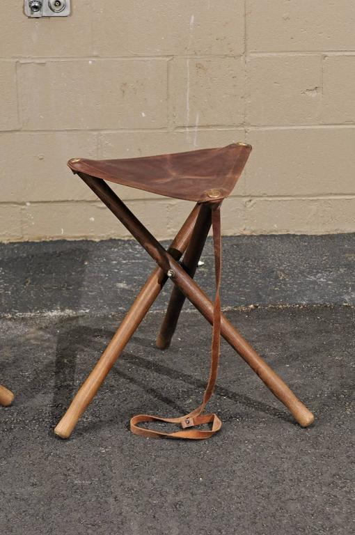 Three French Folding Wooden Stools with Brown Leather Seats and Tripod