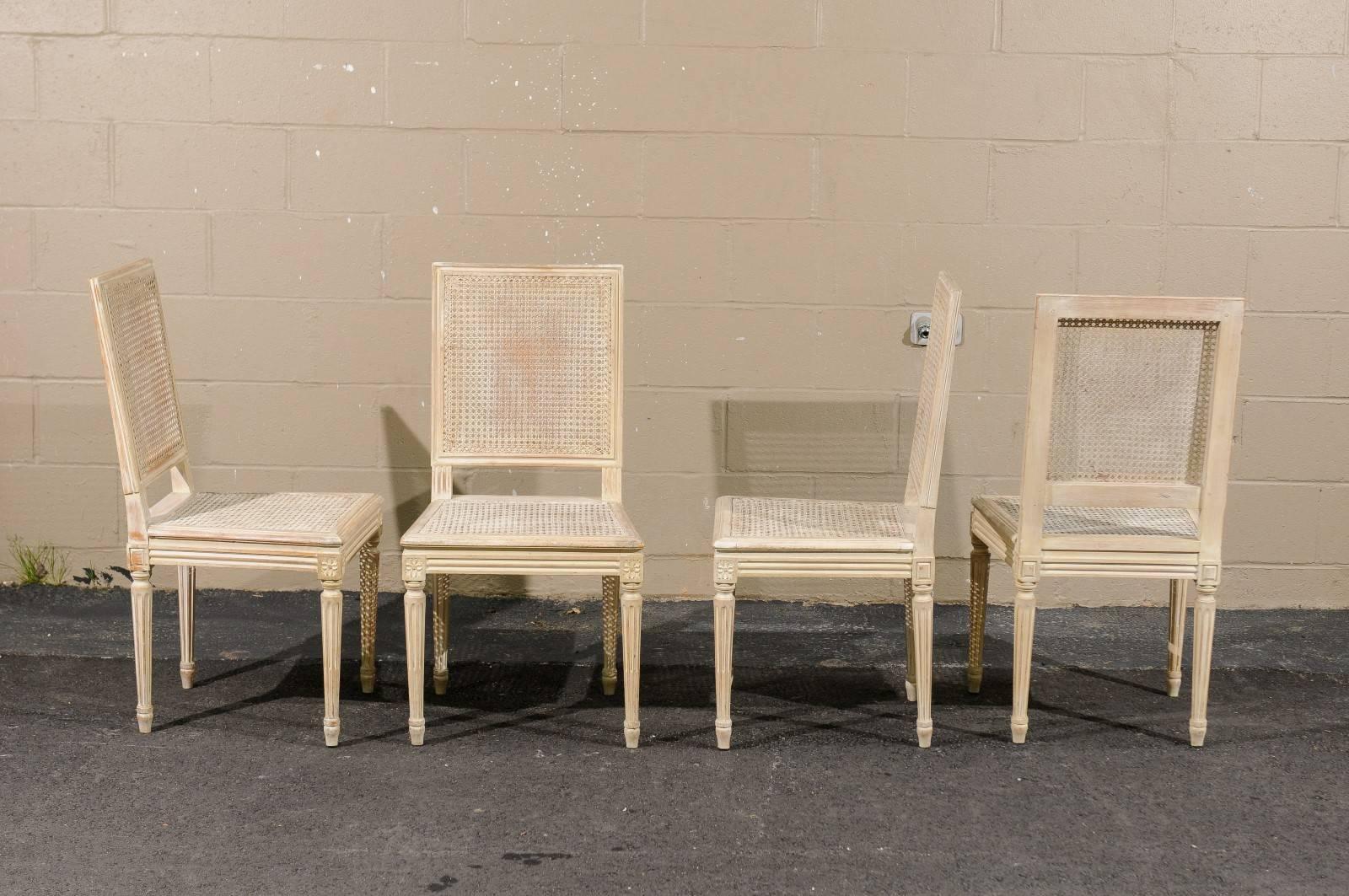 20th Century Set of Four French Louis XVI Style Painted Wood and Cane Dining Chairs, 1970s