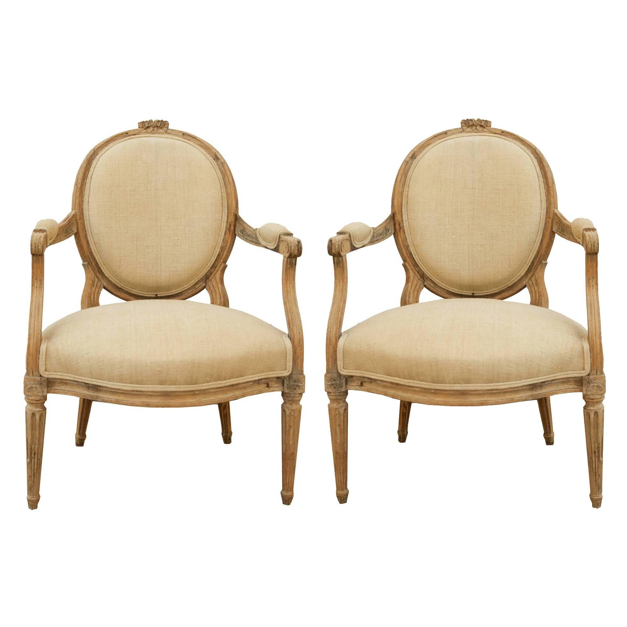 Pair of French, Louis XVI Style Carved Limed Oak Mid-19th Century Armchairs