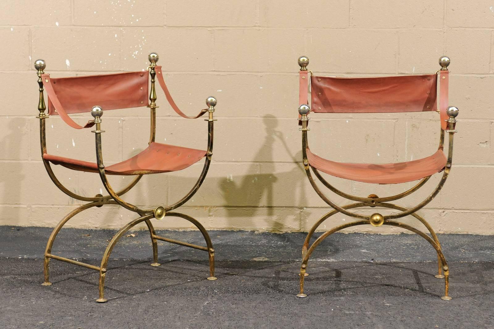 A single French Regency Campaign Curule (also known as Savonarola) chair from the mid-20th century with leather back, arms, seat and a brass body on a half-moon X-shaped base. This elegant leather and brass Curule chair caught our eye. Heavy and