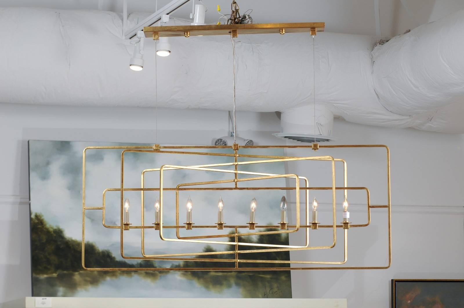 An American eight-light linear gilded metal chandelier. Ultra-modern in form and finish, this rectangular chandelier is a total head turner. Multiple rectangles in varying sizes are layered and set at different angles giving a geometric and sleek