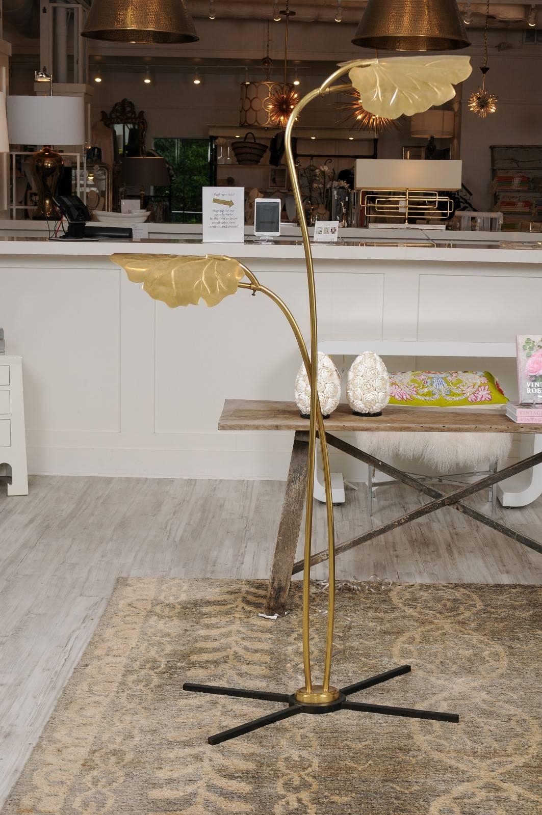 A double leaf Mid-Century Italian style brass floor lamp on iron base. Che bella! With its large, leafy embellishments, this gorgeous floor lamp knows how to make a head-turning statement. Its slender build and detailed accents reflect the style of