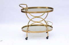 Florentine, 1950s, Two-Tiered Oval Brass and Glass Bar Cart with Curvy Lines