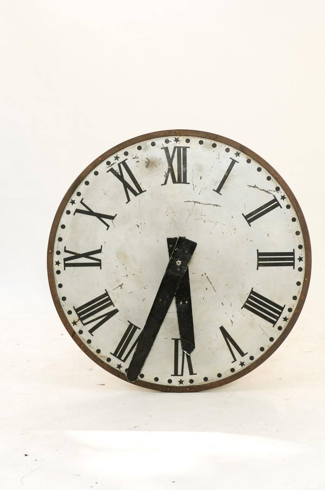 A large French late 19th century clock face with Roman Numerals. This is one of two clocks that came off of a church steeple in the Haute-Loire part of central France. It’s the real thing, and it’s from the 1890s! We found it in Paris, from a vendor
