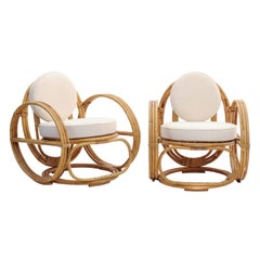Pair of French 1950s Vintage Rattan Lounge Chairs with Upholstered Back and Seat