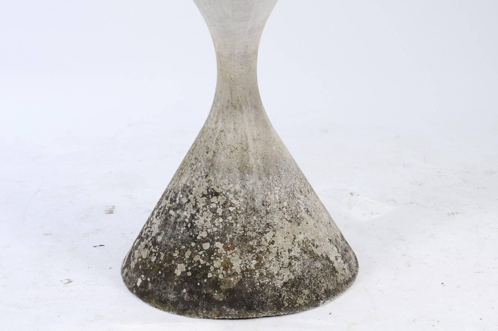 A Swiss vintage Willy Guhl fiber cement 'Diabolo' garden planter from the mid-20th century, originally from Lausanne. This hourglass shaped planter was born in Switzerland in the 1950s and was created by Willy Guhl and manufactured by Eternit. Its