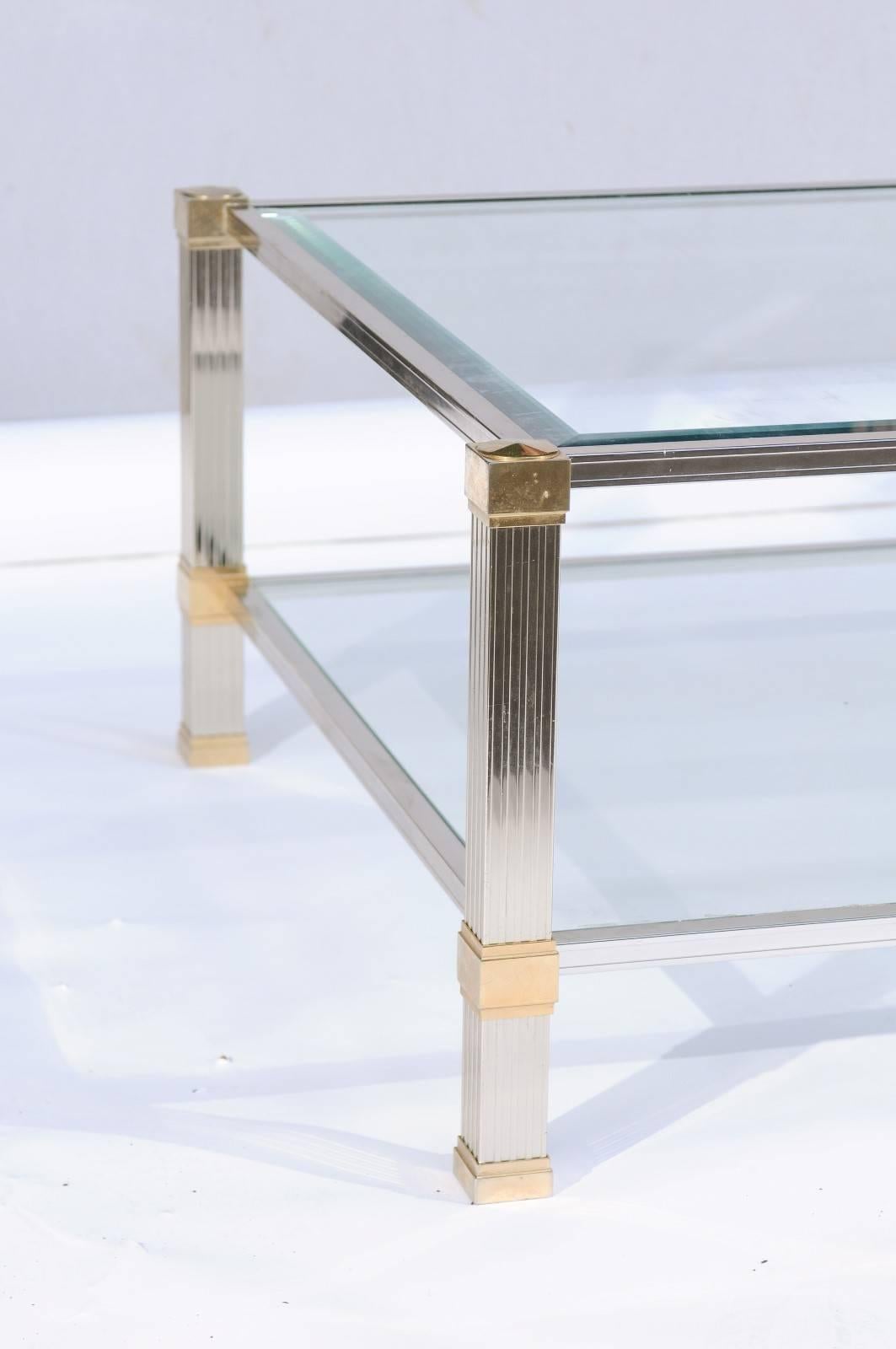 A vintage French gold and chrome coffee table from the mid-20th century with glass shelves, signed by Pierre Vandel. We’re huge fans of anything Pierre Vandel, so when we stumbled upon this handsome gold and chrome coffee table on a French