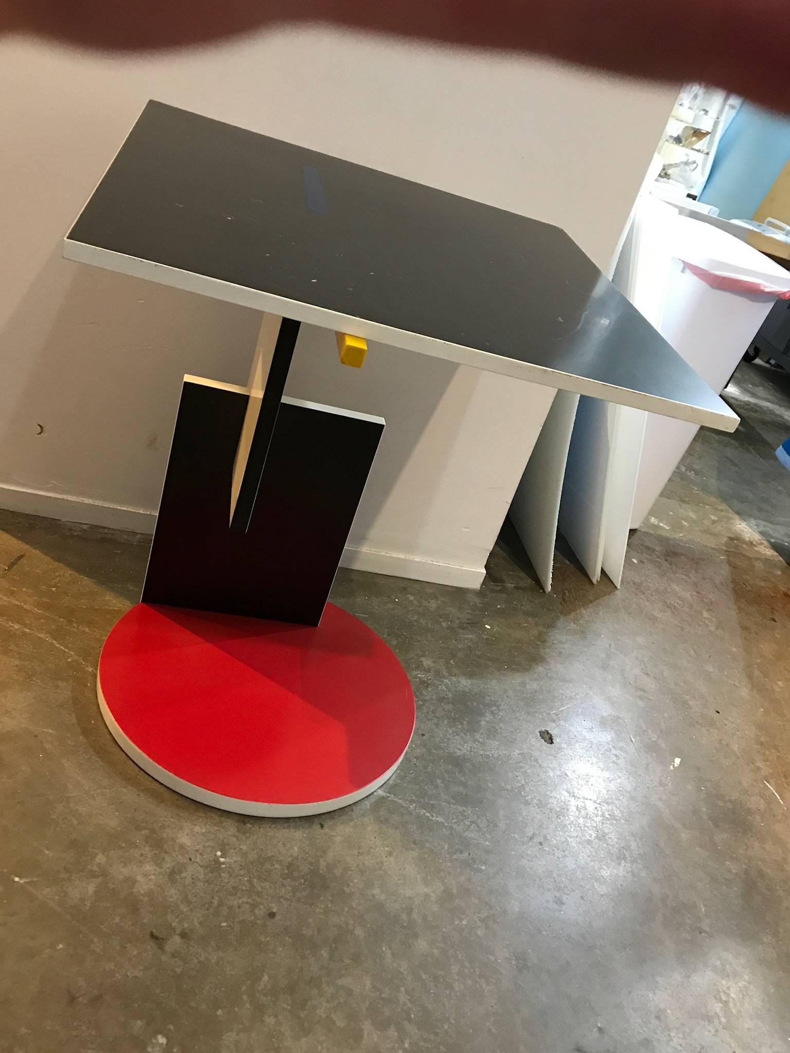 The offered is a side or occasional table by Dutch designer and architect Gerrit Rietveld. Rietveld created this piece for his 1924 Schroeder House. This side table follows the primary color palate and geometric cubist form of De Stijl design. This
