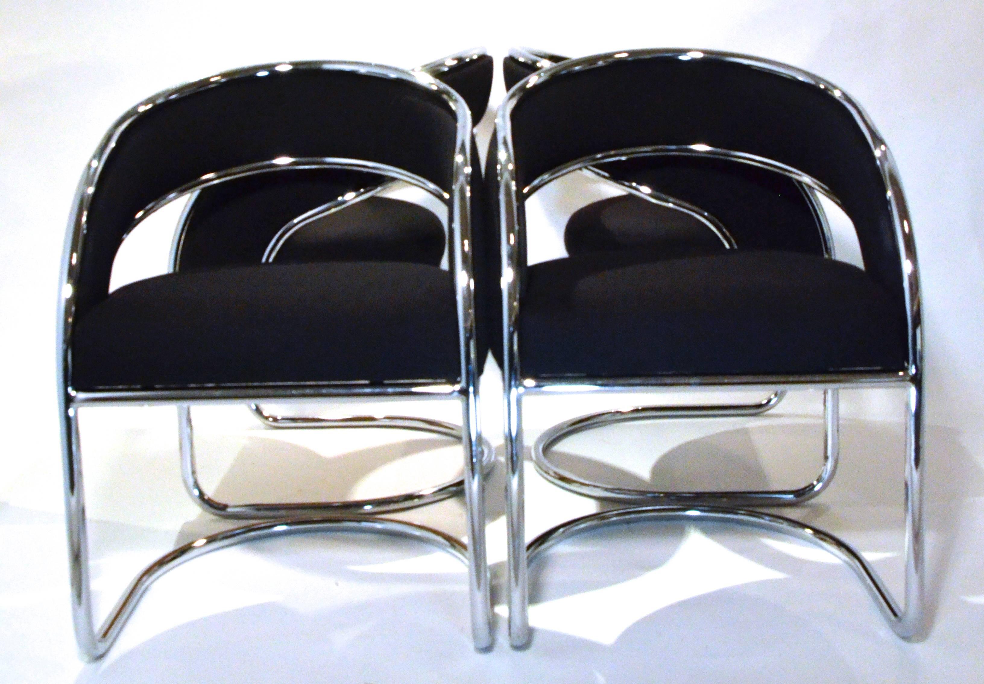 Offered is a unique set of four chrome and wool felt dining chairs armchairs by Contemporary Shells Inc. Contemporary Shell Inc. was based in Hempstead NY and produced works for many designers including Arthur Umanoff. This set was designed in the