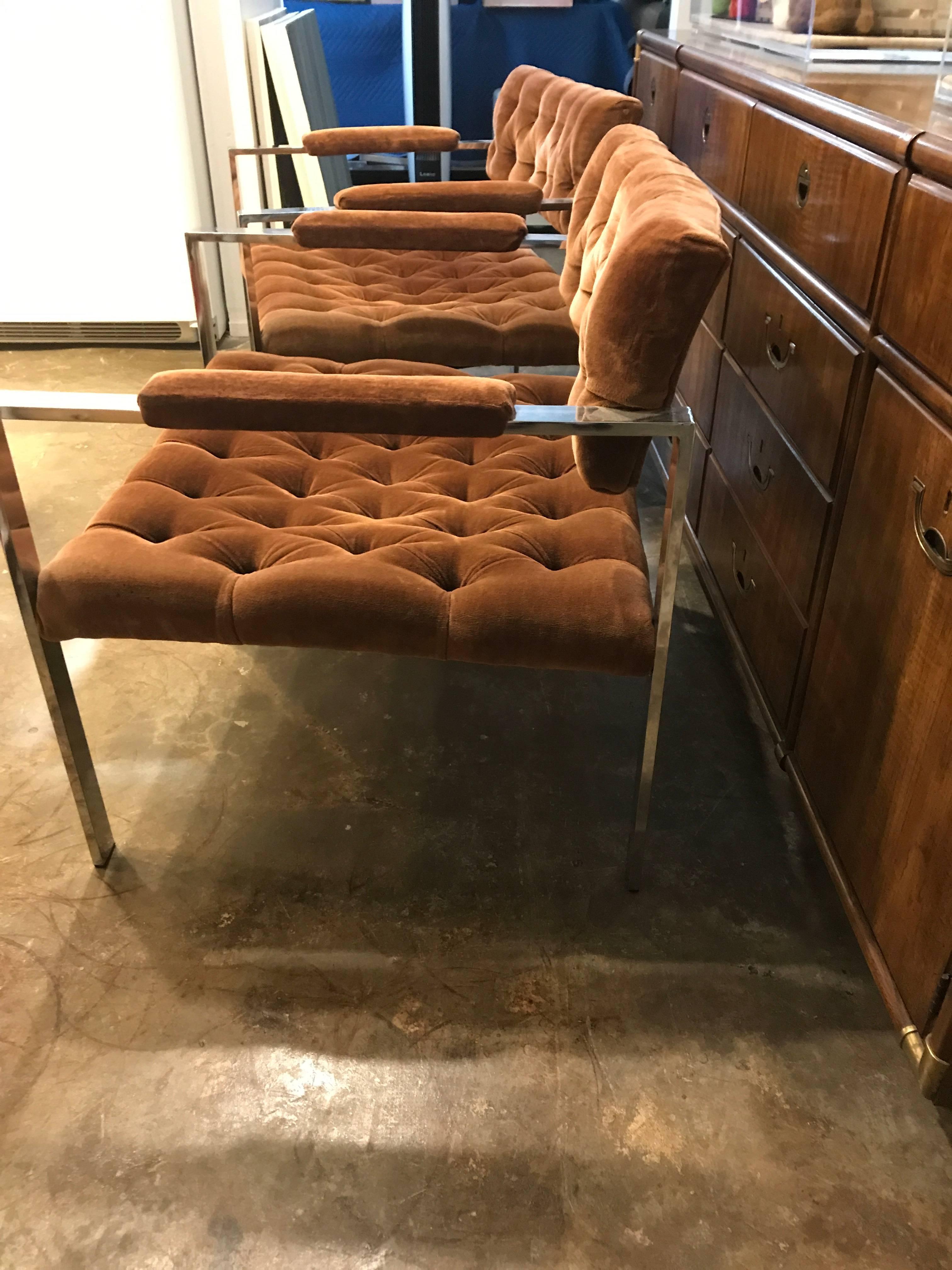 Offer is a pair of Erwin-Lambeth lacquered chrome arm or lounge chairs, upholstered in a cognac tufted velvet. We will upholster in-house COM or can provide a nice cotton velvet in a variety of colors at our cost. This design is iconic for the