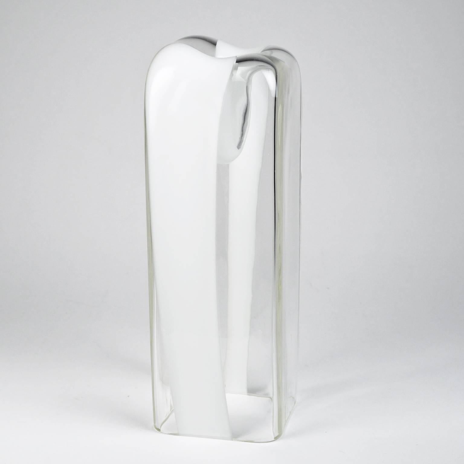 Rare tall sculptural Murano glass vase or candle holder by Carlo Nason for AV Mazzega from the 1970s. The handblown clear and white glass culminates in an organic "vessel" that can hold a single blossom or a candle. 