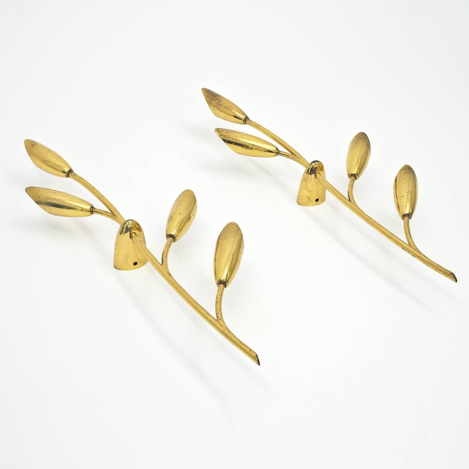 Beautiful lyrical brass wall lights from Germany, 1950s. While these stylized branches were likely conceived as wall lights they would also make for lovely indirect ceiling lights. Each light has four brass E14 sockets (40W each) with new wiring.