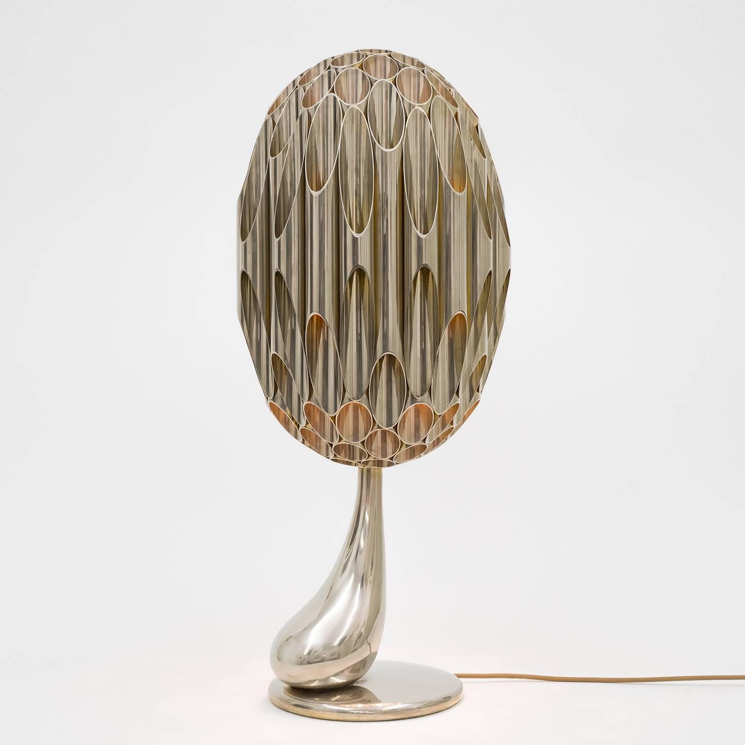 Spectacular Maison Charles table lamp dubbed 'Morille' from the 1970s. Atop the solid cast base and stem sits an intricate tubular structure in the shape of a stylized morel. The entire lamp is nickeled on the outside and gilt on the inside thus