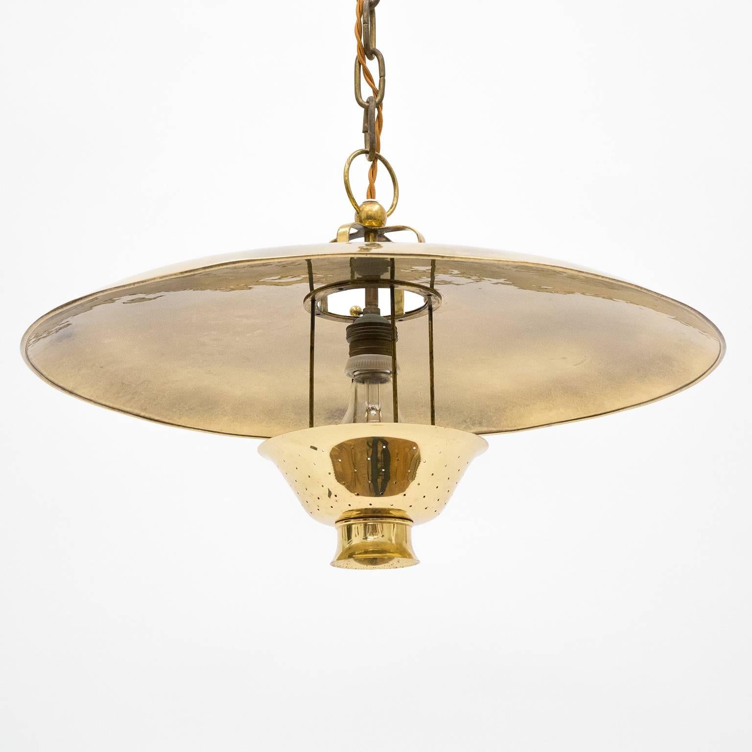 Breathtaking and beautiful all brass pendant by BAG Turgi, Switzerland, 1940s. Style-wise this is at the crossroad of Art Deco and Modernist, made entirely of brass with an incredibly rich and smooth patina. The small pierced brass diffuser can be