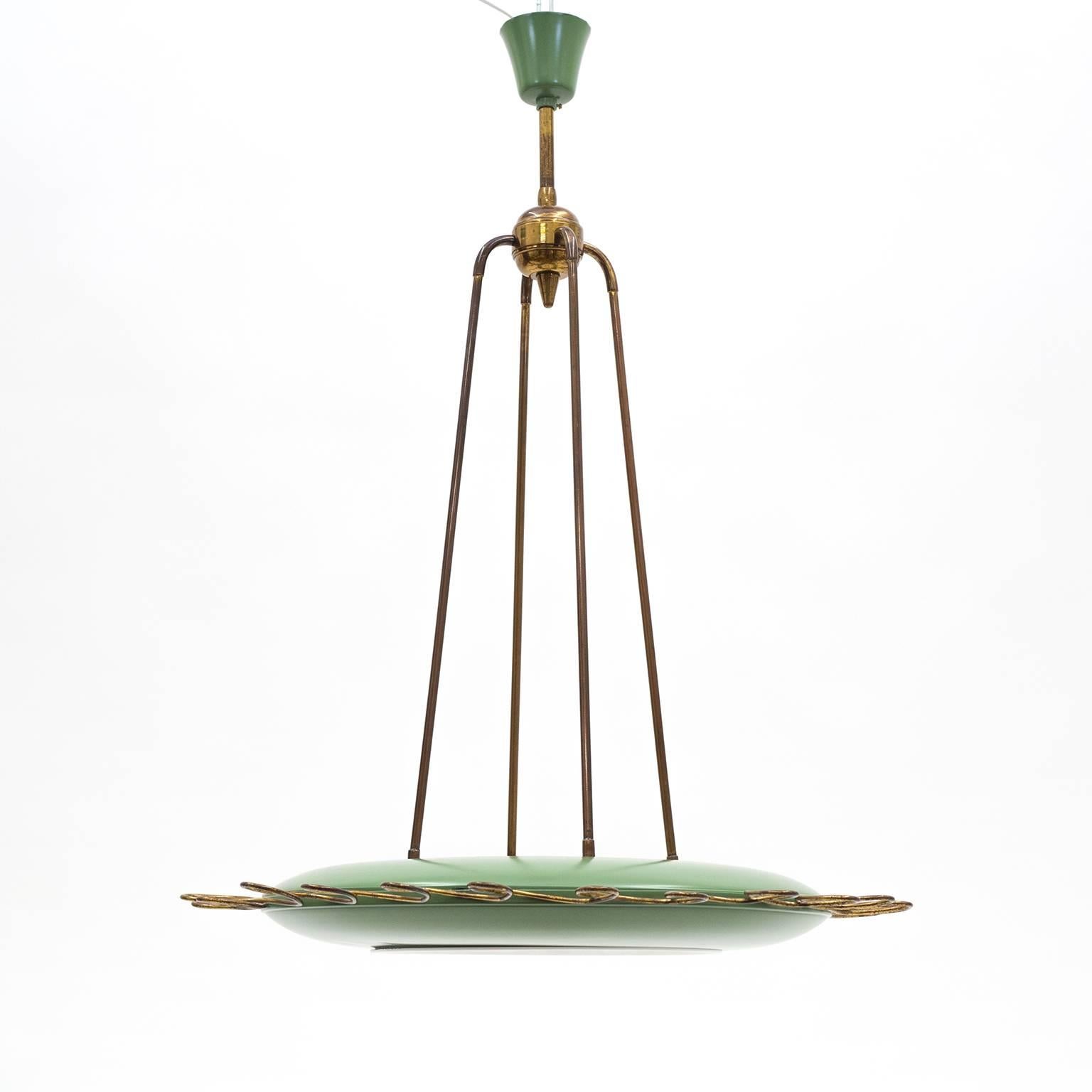 Very unique Italian Mid-Century eight-light chandelier. A mint lacquered aluminium ring-shaped saucer with brass loops on the outside and eight lights on the inside. The brass has a lovely rich patina to it and the lacquered parts have been