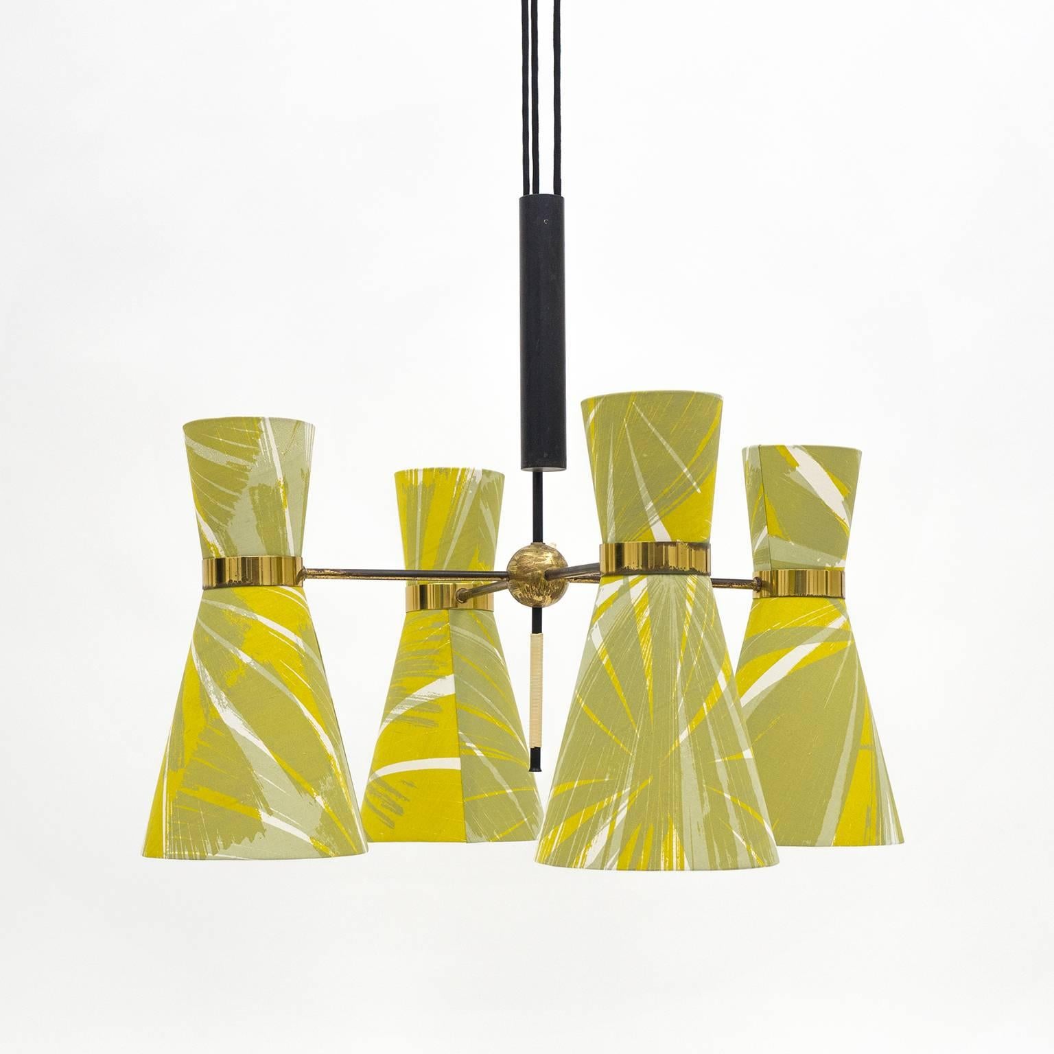 Stunning counter balance chandelier by J.T. Kalmar, circa 1950. Four brass arms, each with a dual cone shade with new hand-printed fabric. Each cone has one E27 socket pointing down and one E14 socket pointing up. There is a switch on the central