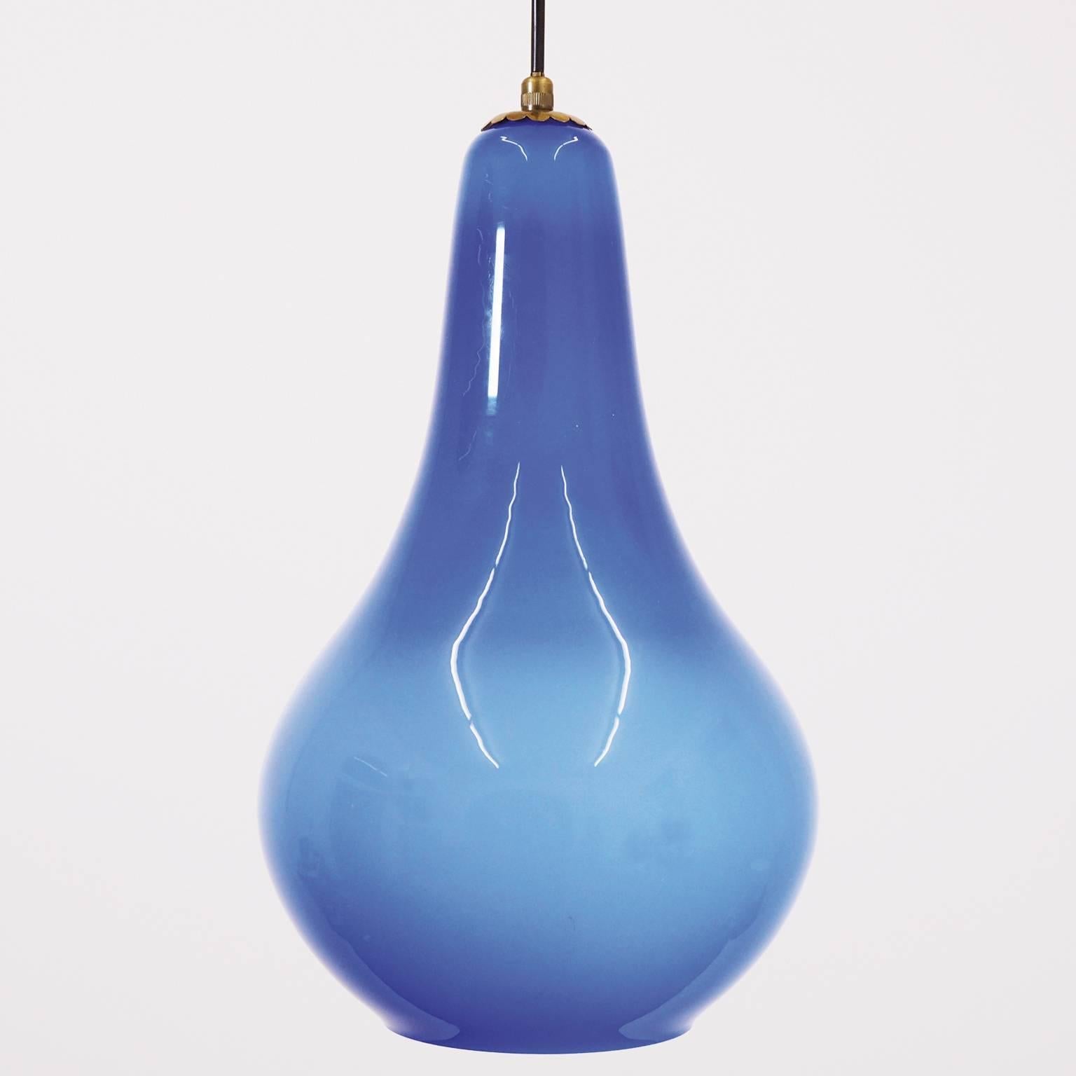 Lovely pear shaped cased blue glass pendant attributed to Vistosi. Charming brass detailing. One original brass E27 socket with new extra long wiring.