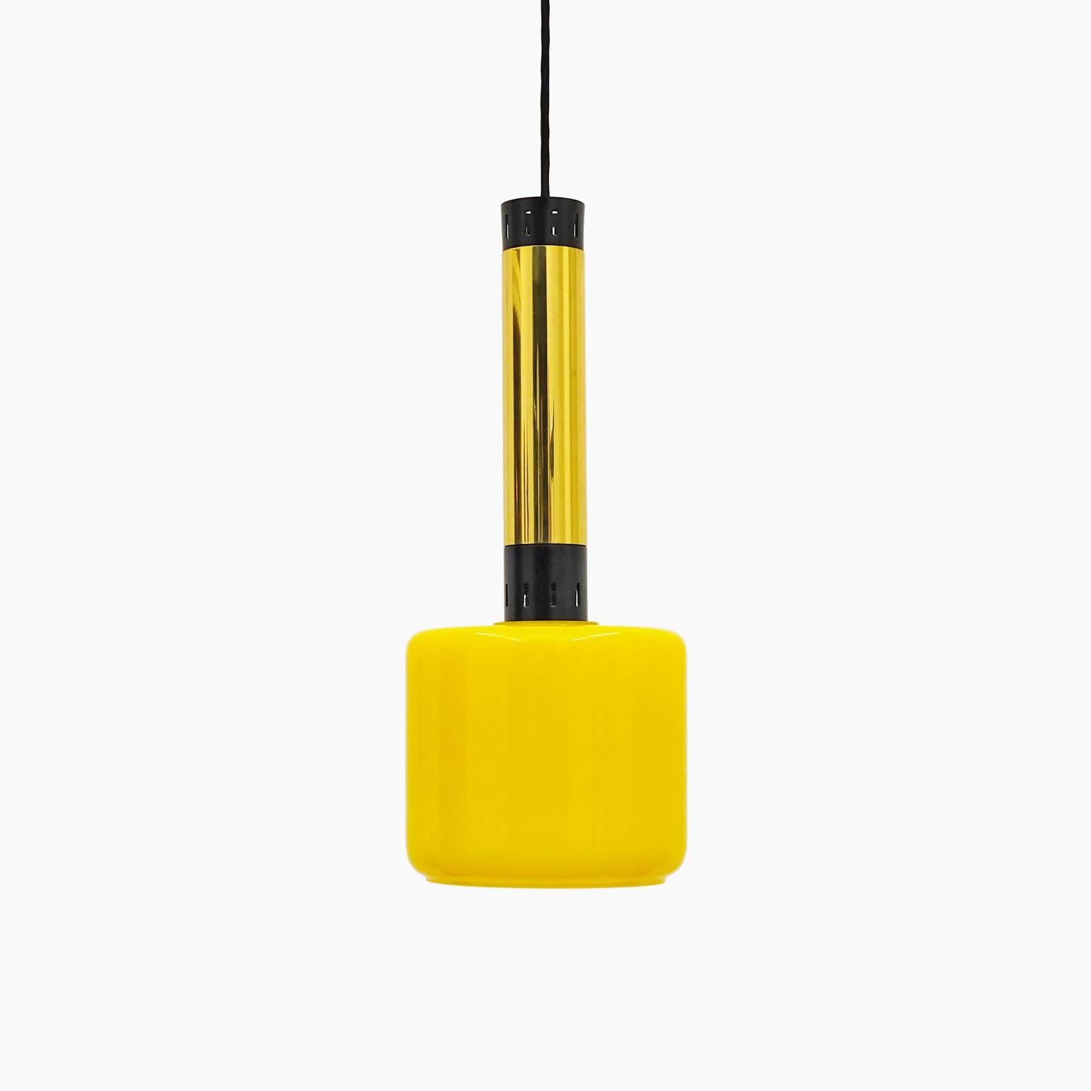 Pair of Stilnovo glass, brass and lacquered aluminum pendants from the 1950s. Lovely yellow blown glass diffusers with white inner casing. One original brass E27 socket with new textile wiring. Max drop height is 60 inches/154 cm.