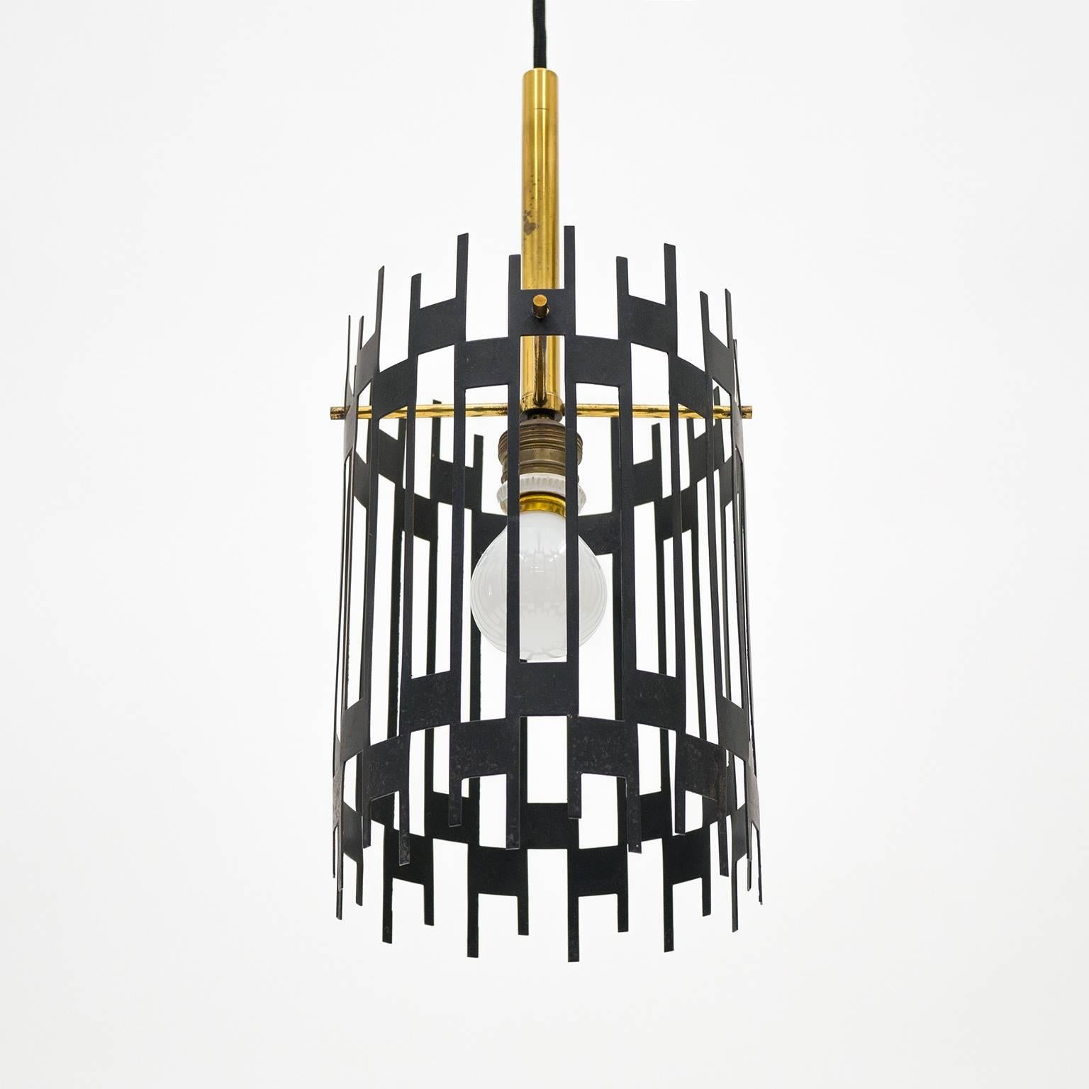 Highly unique modernist cage pendant or lantern from Italy, 1950s. A geometric graphical black lacquered steel structure is fitted on a minimalist brass support enclosing a single bulb. Nice original vintage condition with some patina to the brass