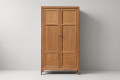French Reconstruction Oak Two-Door Armoire, Paneled Doors, 1940s. This armoire