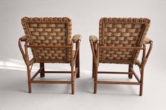 Dans le style d'Audoux Minet, paire de fauteuils, rotin et corde, France, années 1950