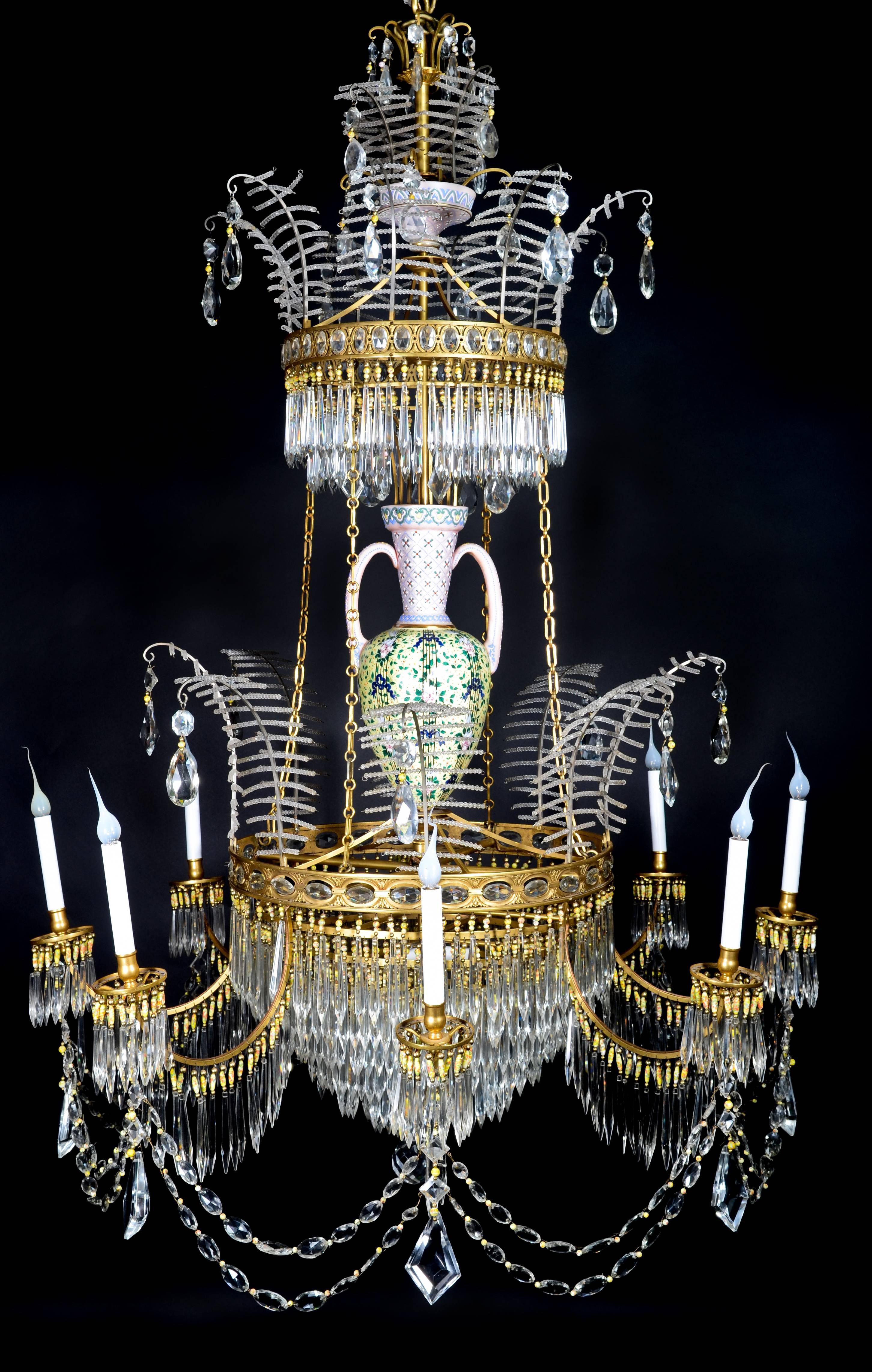 A palatial and large antique Russian neoclassical gilt bronze, cut crystal and opaline glass multi light chandelier of exquisite craftsmanship embellished with cut crystal prisms, chains, opaline glass beads and finally adorned with a large opaline
