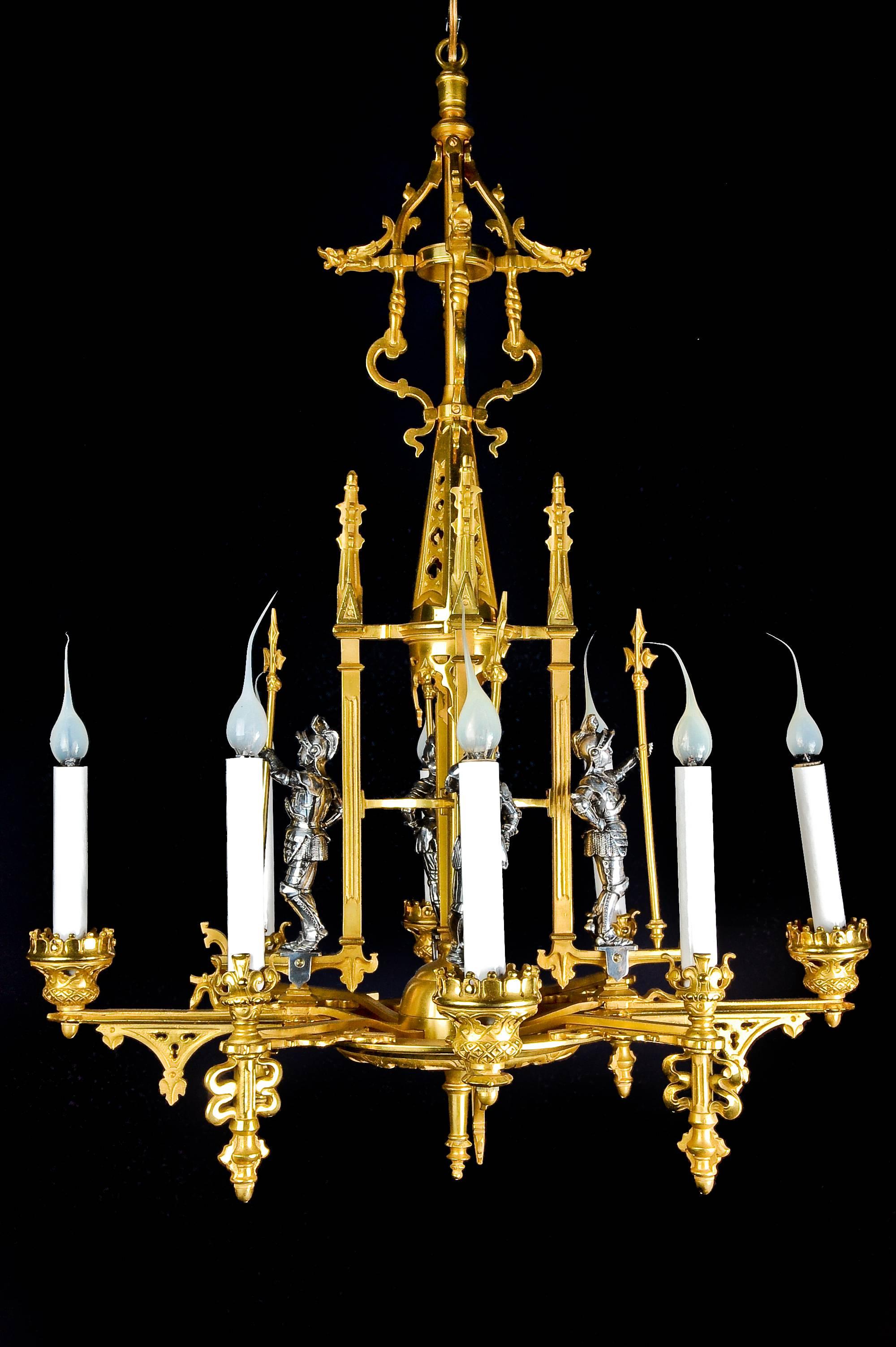 A French Louis XVI style gilt bronze and silvered bronze figural chandelier embellished with four figures of soldiers.