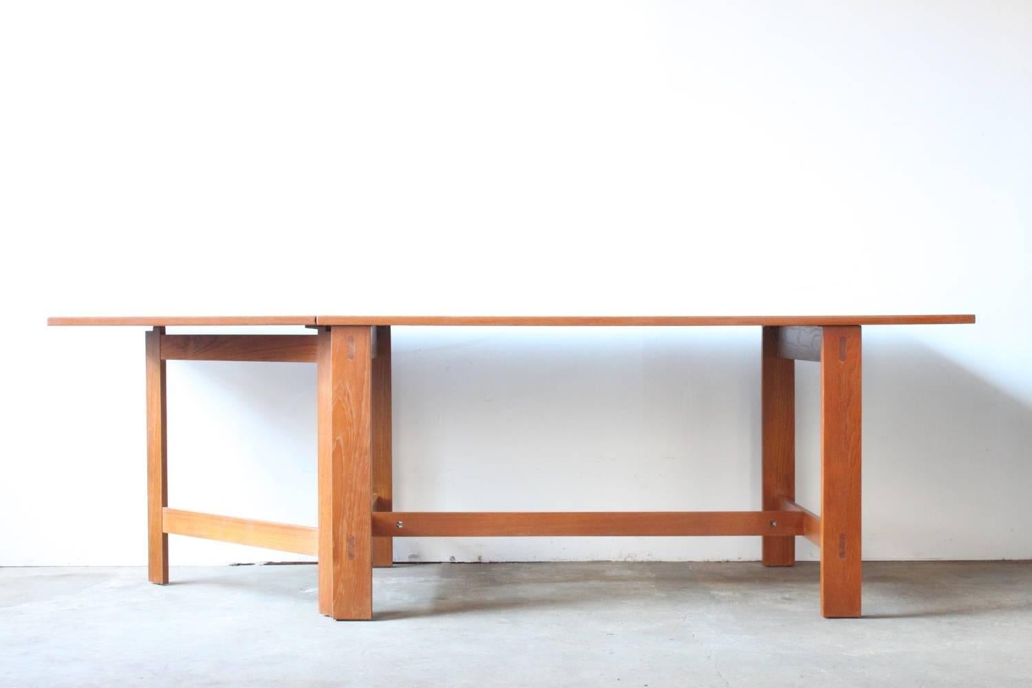 Swedish drop-leaf teak dining table. Gateleg detail.