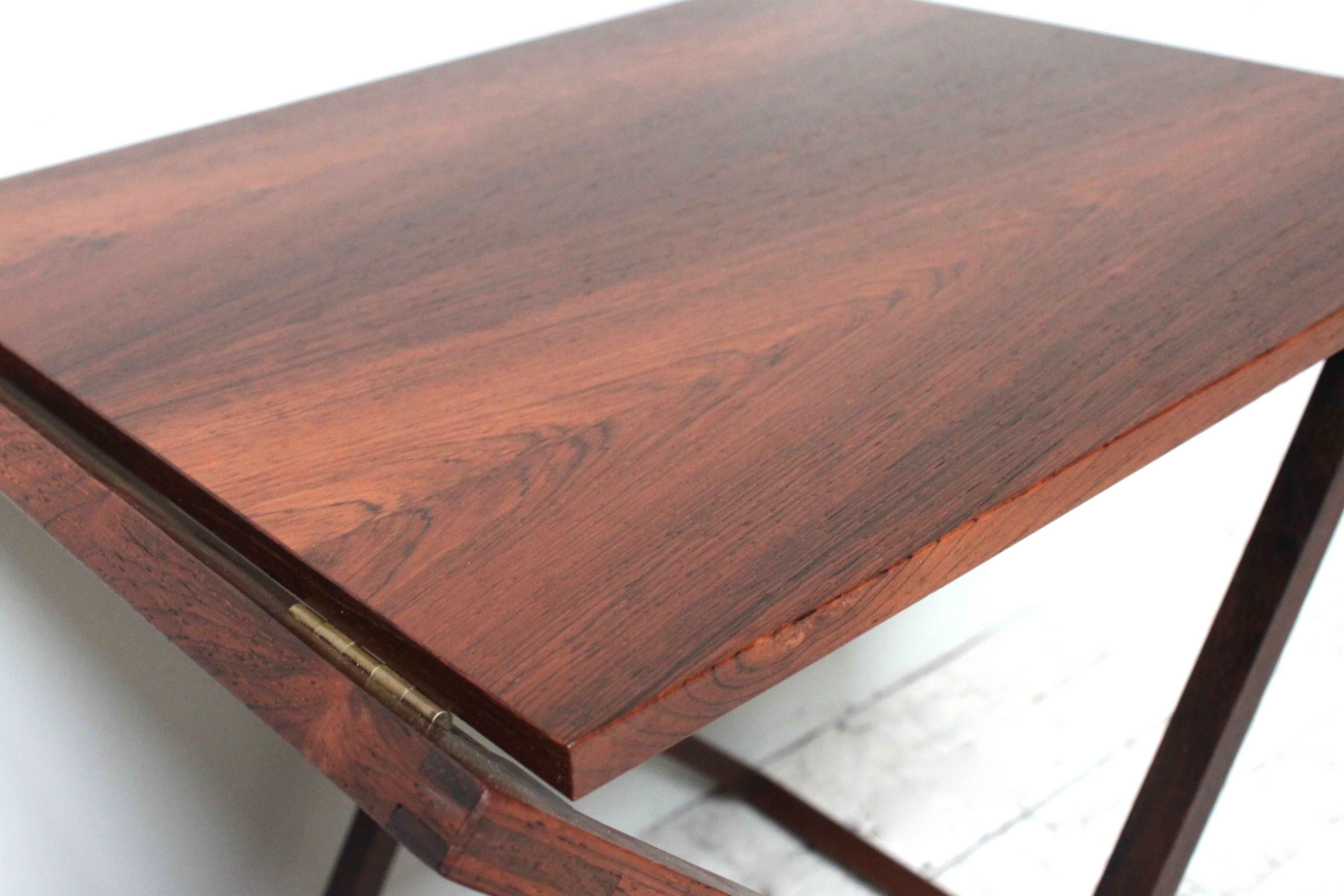 Folding rosewood tray tables by Illum Wikkelsø.
  