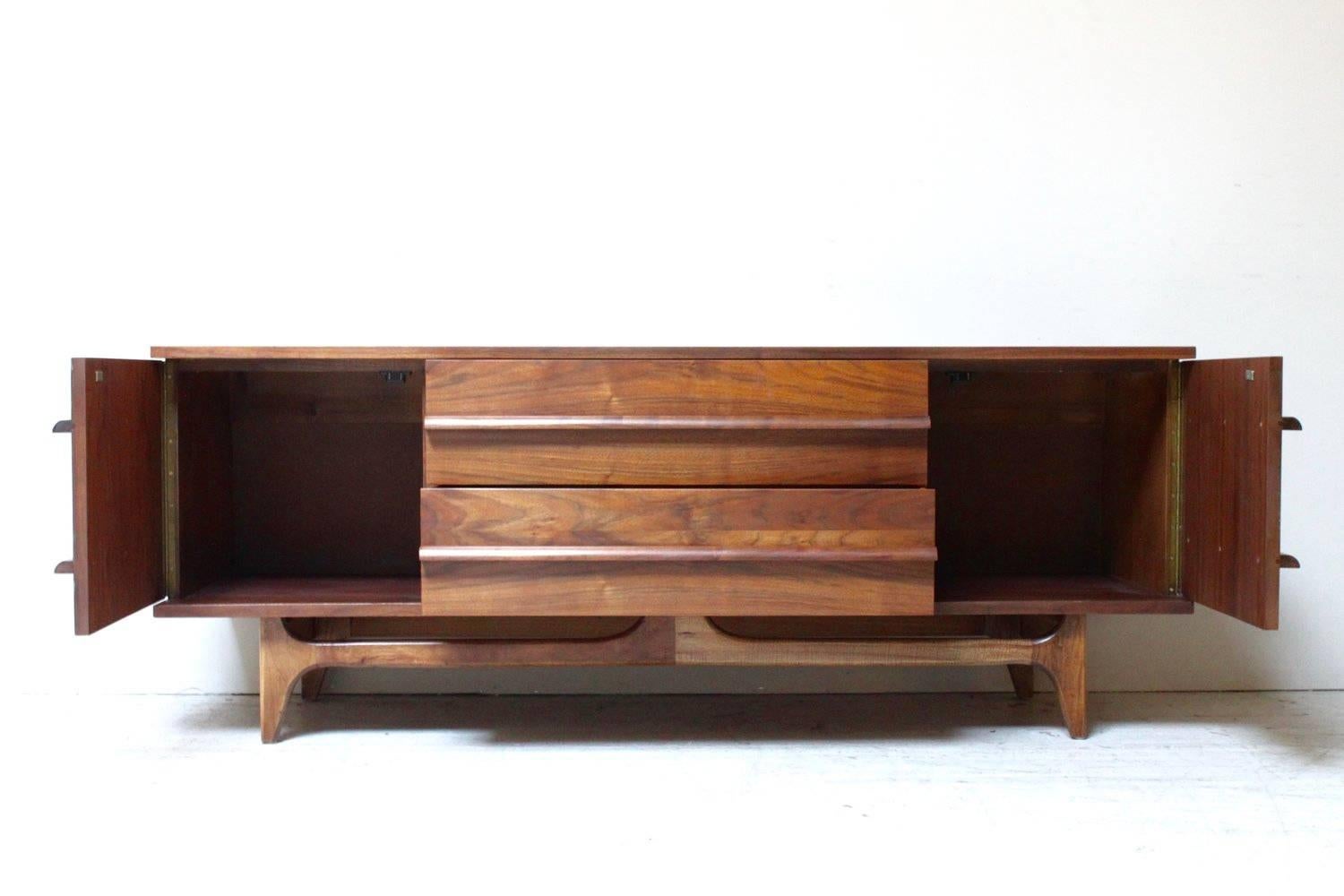 Bow front black walnut credenza by Young Mfg. Co., circa 1960.
