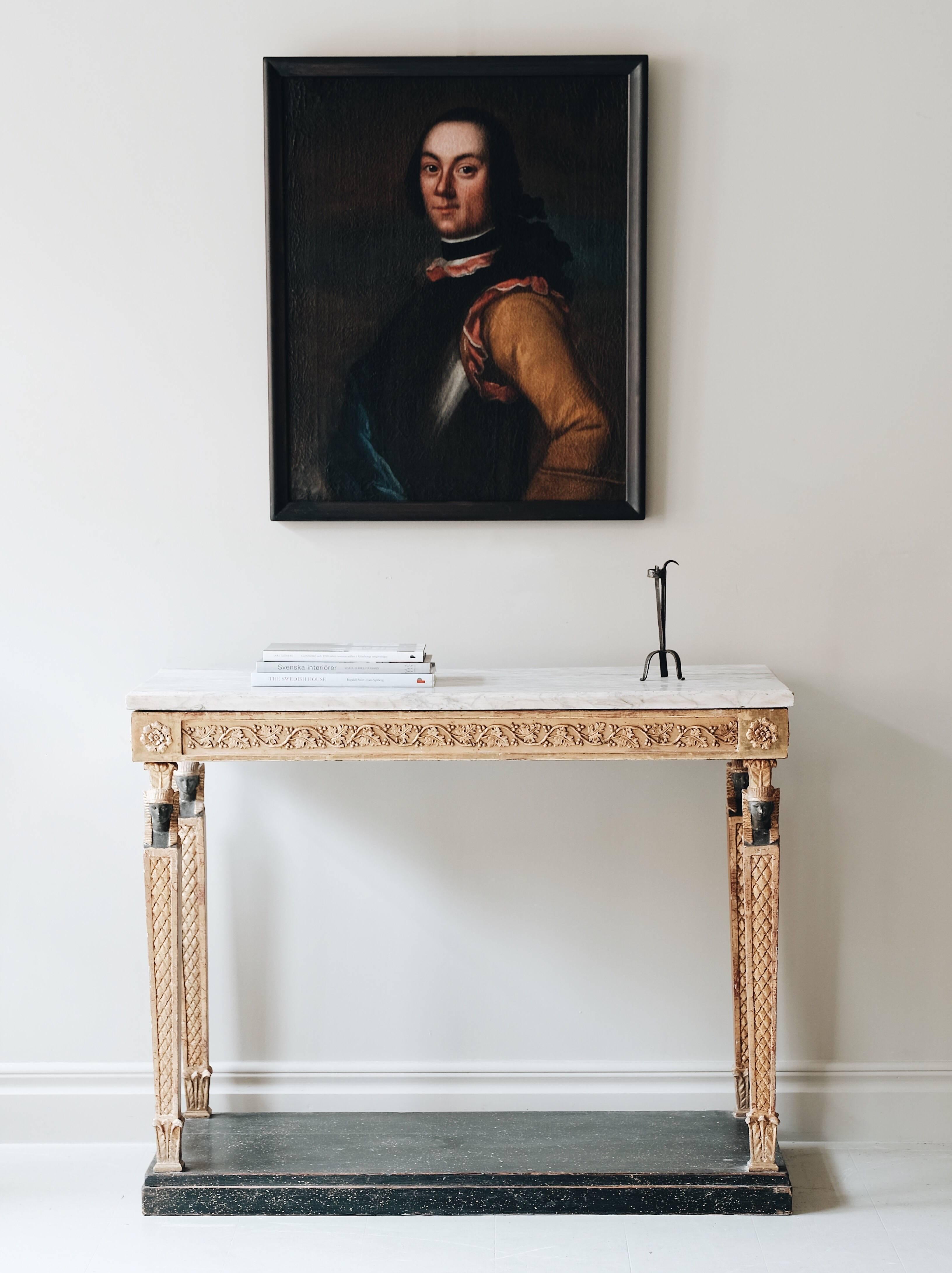 Fine late Gustavian early Empire giltwood console table in Egyptian taste with Carrera marble top. Stockholm, circa 1810.