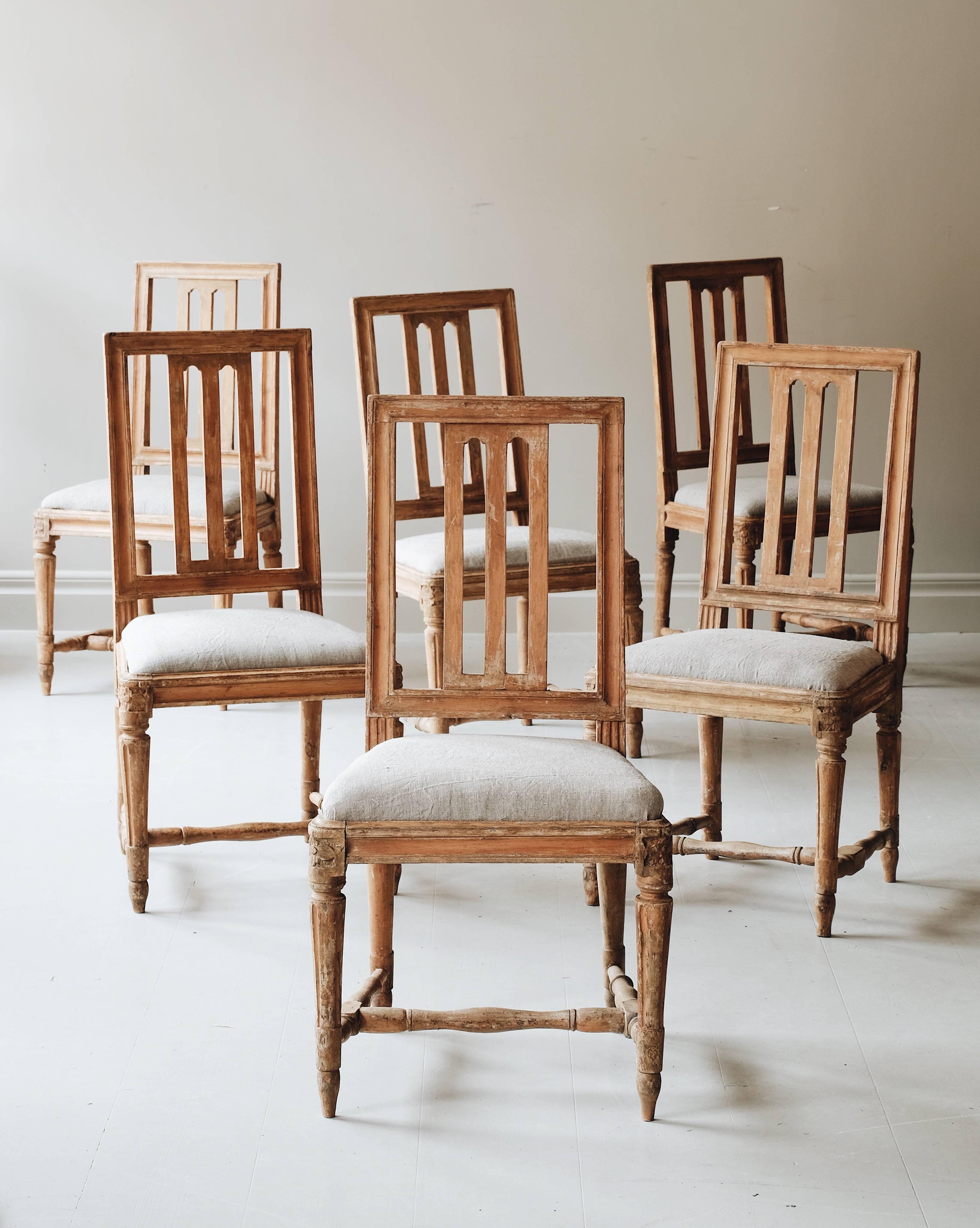 A fine set of ten matched (6 + 4) Early 19th-century Gustavian chairs in original color with retouches to make a set. Ca 1800, Stockholm, Sweden. 

Attributed to master chairmaker Carl Johan Wadstrom (CIWS) 1788-1816, Two of the chairs with the seal