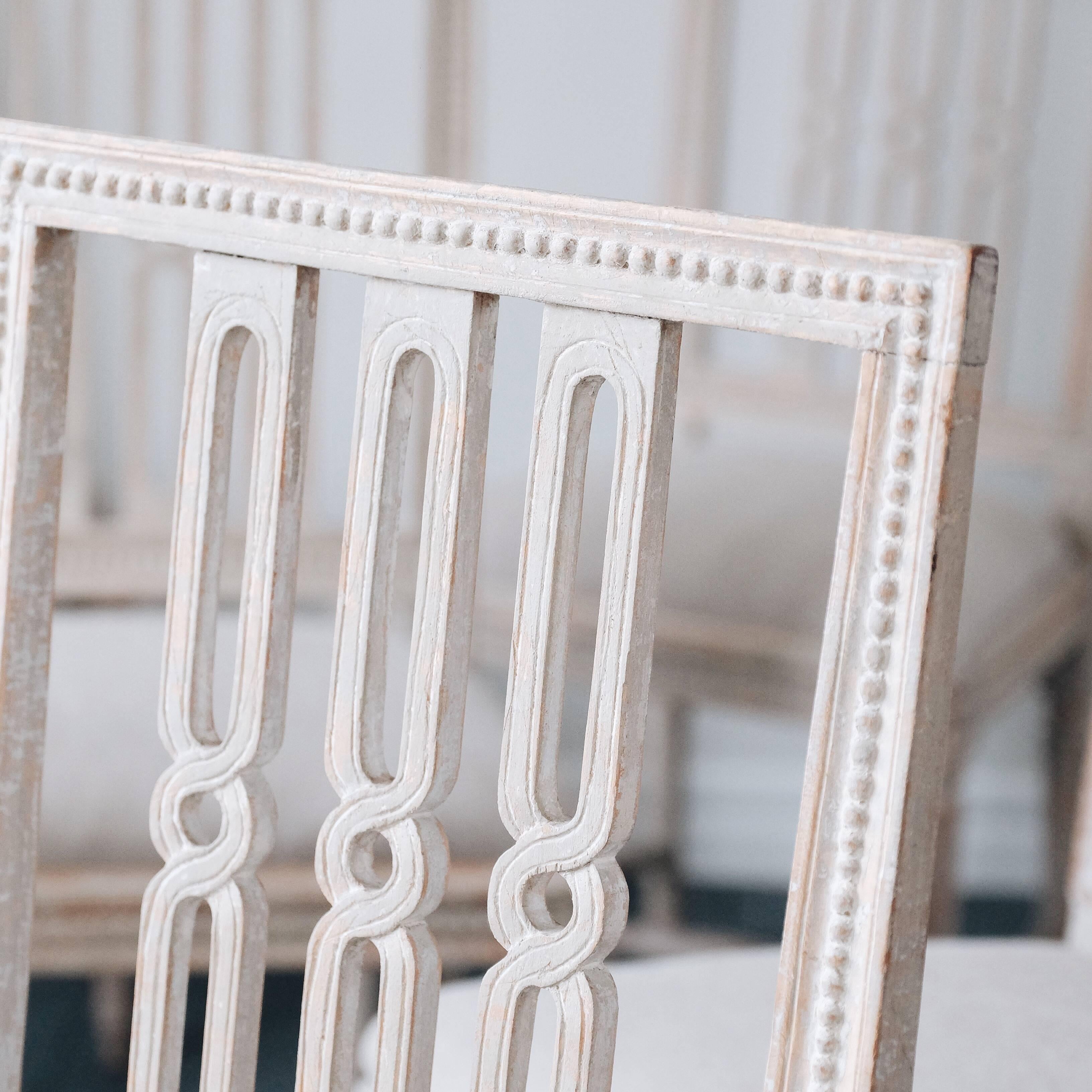 A fine and original set of six 18th century Gustavian period dining chairs in outstanding quality. They have been expertly dry scraped to the original surface showing the original pearl grey colour. Stamped with the Stockholm chair makers guild and