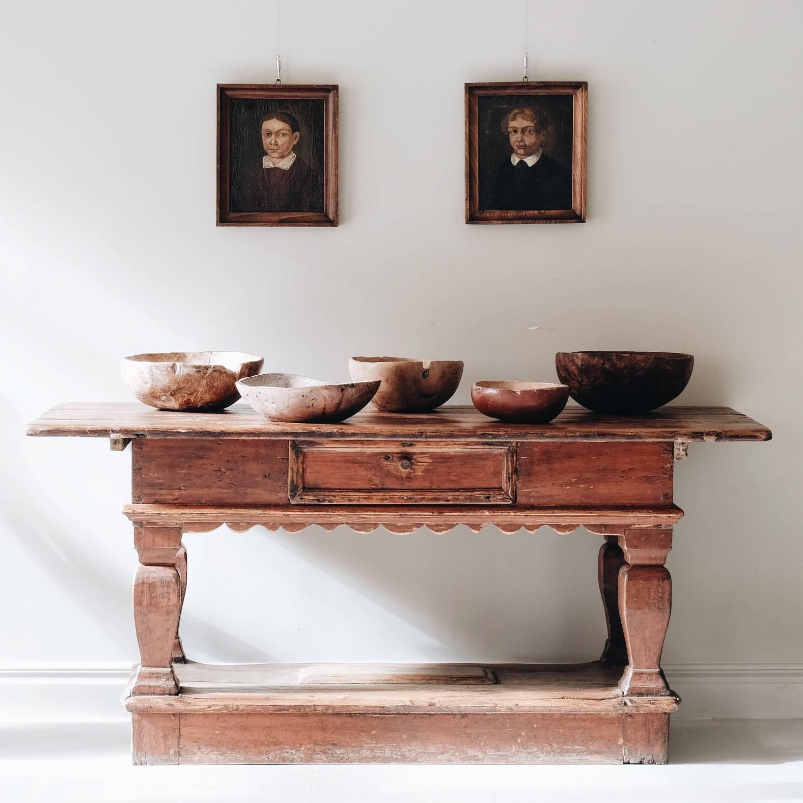 Exceptional and most unusual 18th century Swedish Baroque table in original color with one drawer to the front and removable lid to the bottom base. The table has a lovely shape to the skirting on all four sides so it works excellent as a center