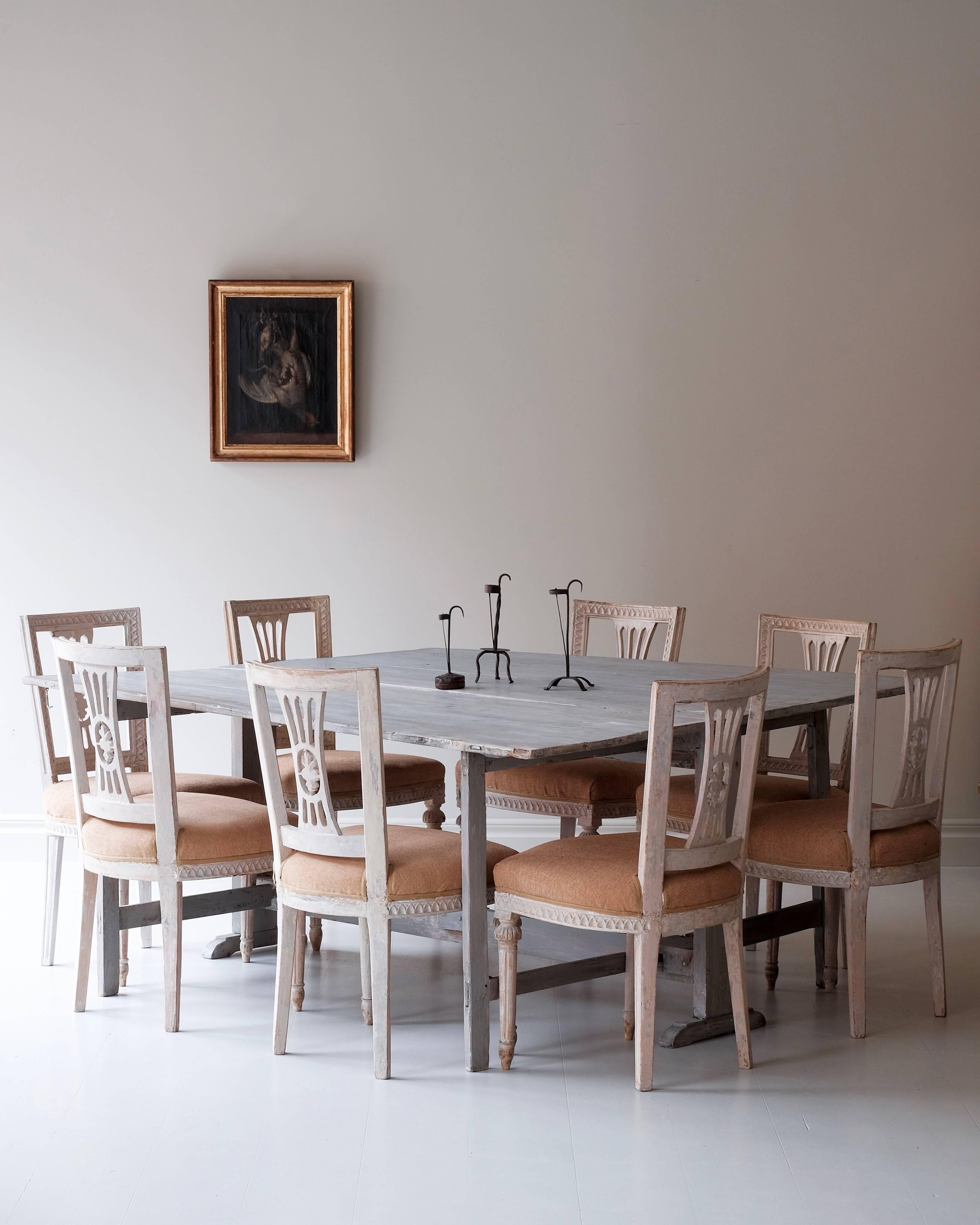 Rare set of eight Gustavian dining chairs in original colour with rich carvings. Attributed to master chair maker Johan Lindgren (Stockholm 1780-1800). 

Provenance: Ekeblad family, Stola manor house.

All these chairs where commissioned for the