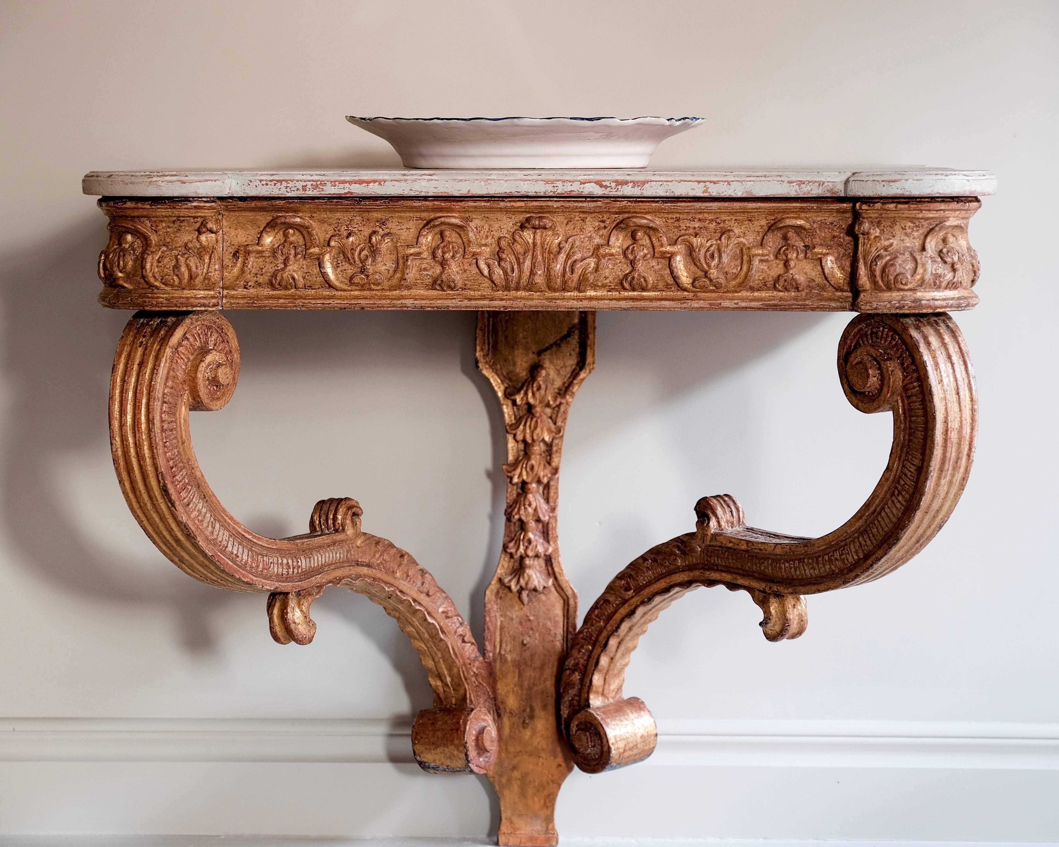 Remarkable 18th century baroque giltwood wall-mounted console table. Sweden, circa 1720.

Attributed to Burchard Precht (1651-1738) originally from Bremen, Precht arrived in Stockholm in 1674 to work at the Drottningholm Palace and was named