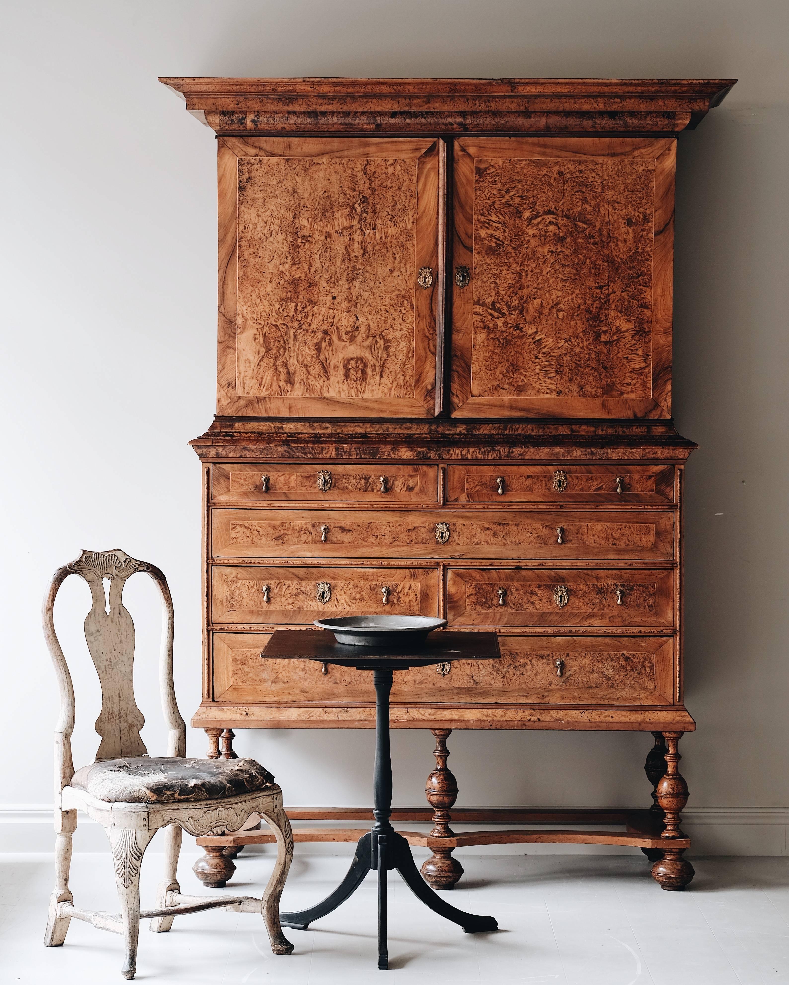 Remarkable and most unusual Baroque alder root cabinet standing on a well carved baluster turned base with unified shaped stretcher to onion feet. Sweden, circa 1730.

   