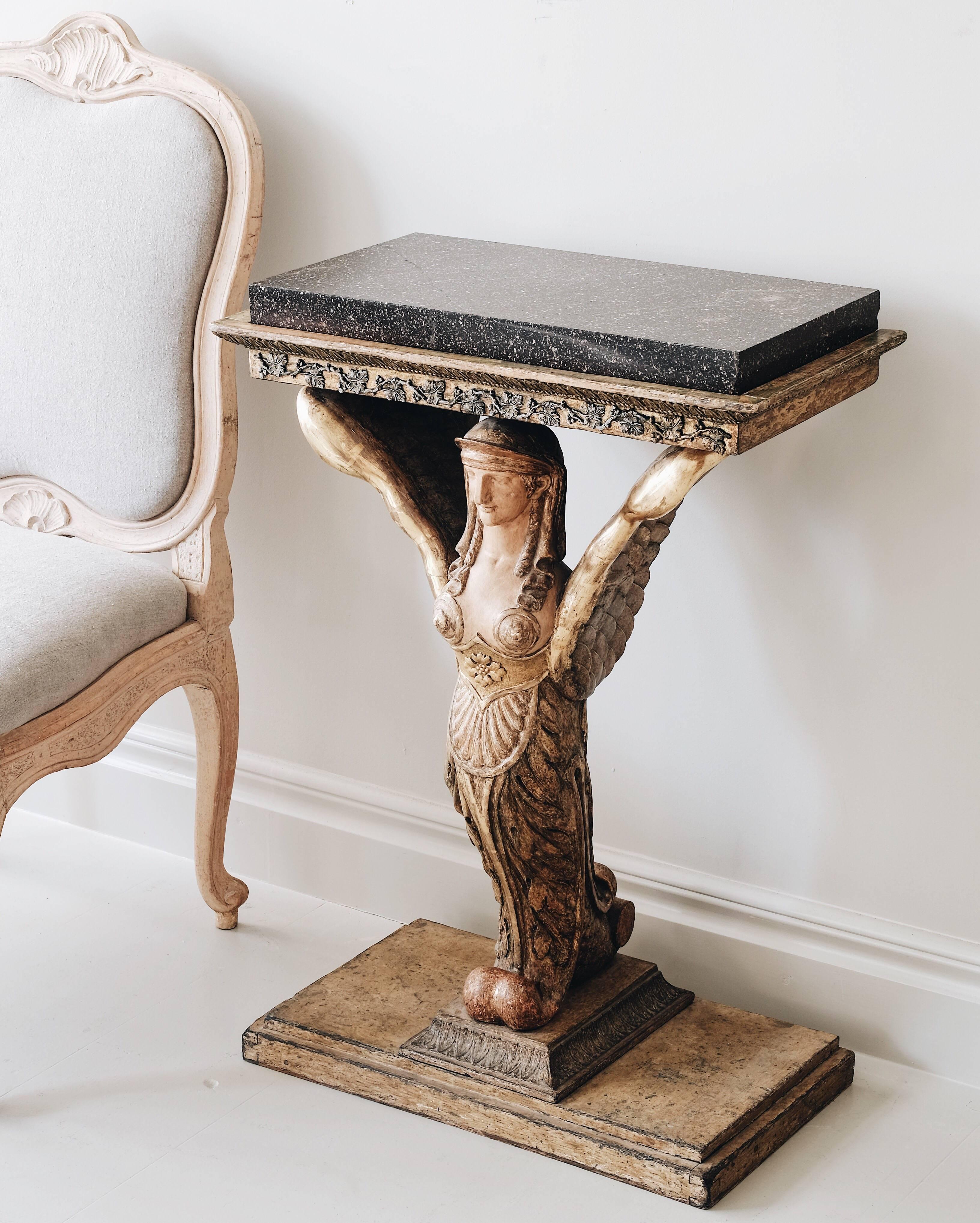 Exceptional early 19th century Late Gustavian console table with porphyry top, Gothenburg, circa 1815. Attributed to Pehr Gustaf Bylander. (master sculpture and mirror maker 1810-1852)

Pehr Gustaf Bylander was a mirror-maker in Gothenburg active