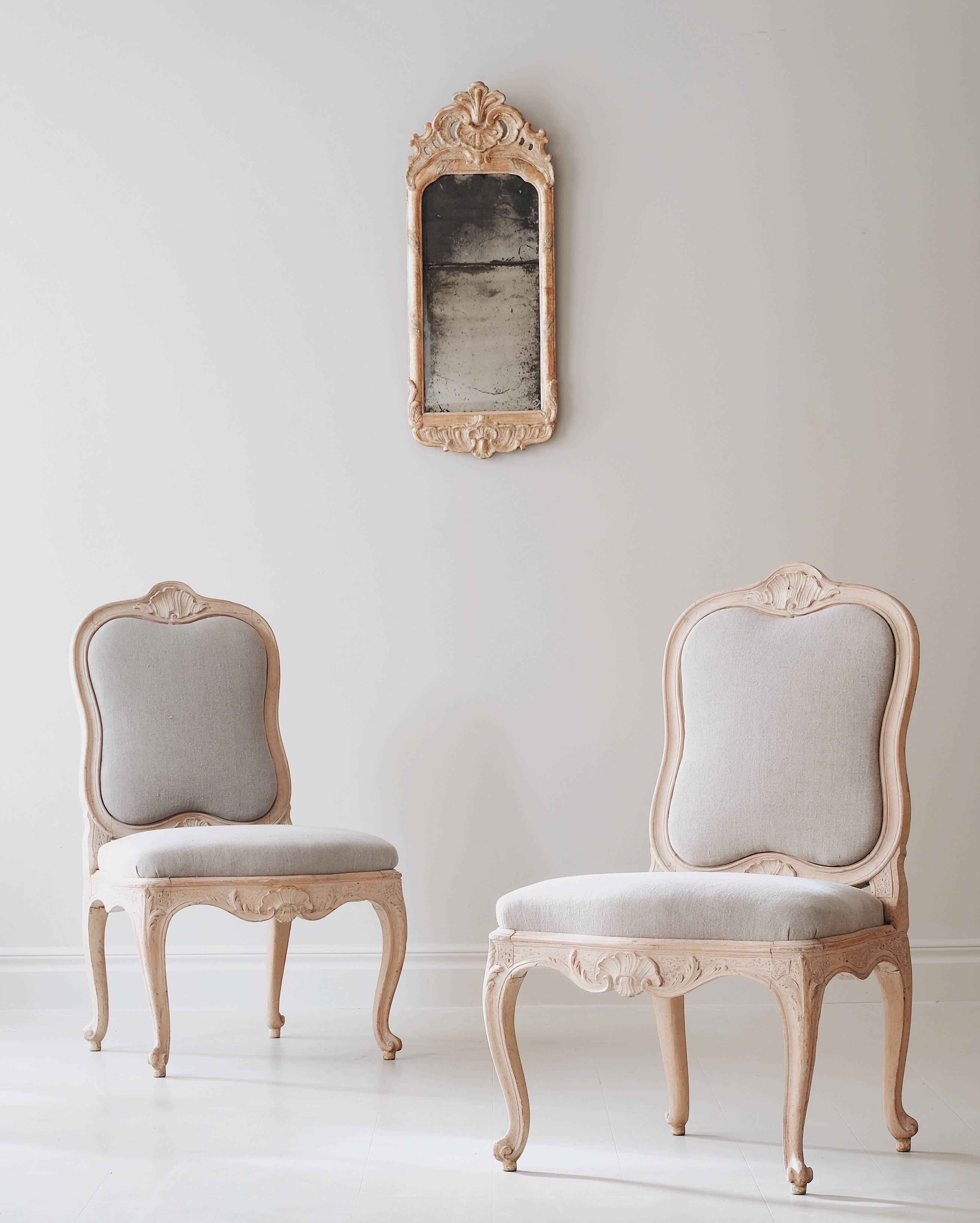 Exceptional pair of Swedish Rococo period chairs in their original finish and the initial padding upholstered in a new raw linen, circa 1760 Stockholm, Sweden.

Literature: Lars Sjöberg. Stolar, taburetter & fåtöljer i Sverige från 1600 till 1800.