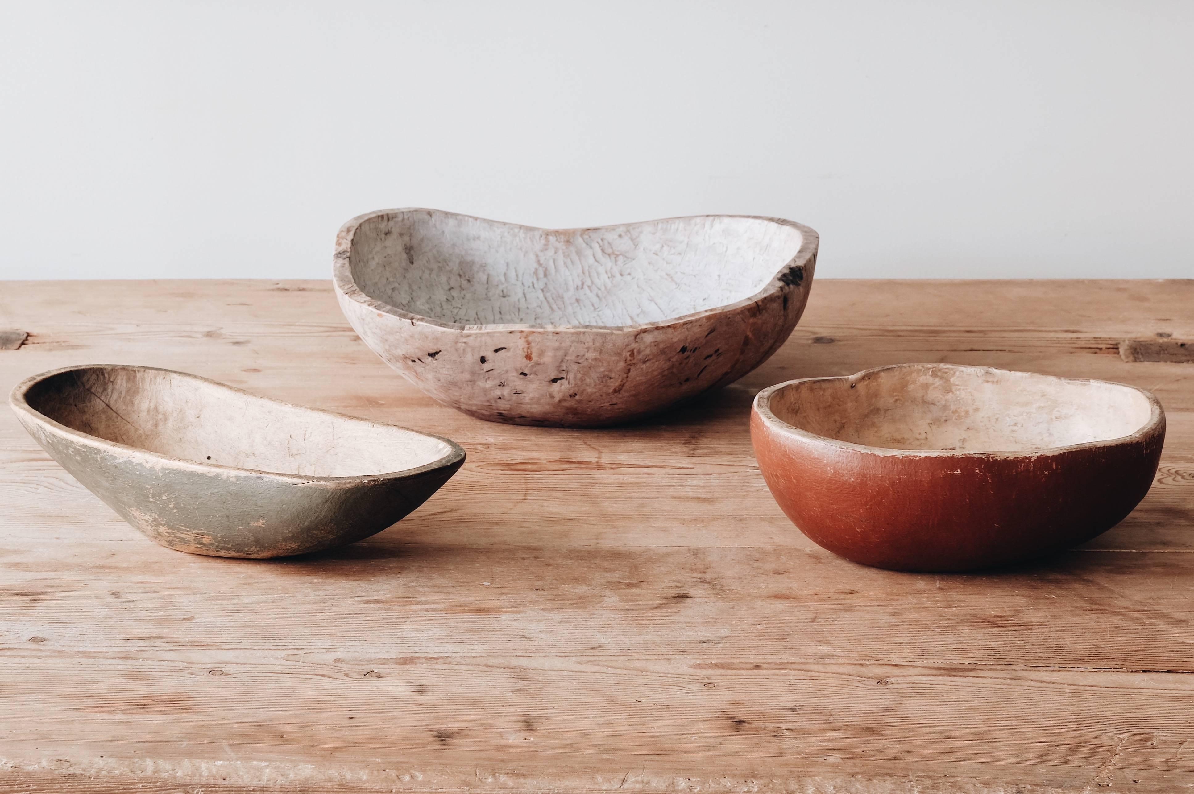 Collection of three beautifully shaped 19th century provincial / Folk Art root wood bowls in original condition, Sweden, circa 1800-1890.
