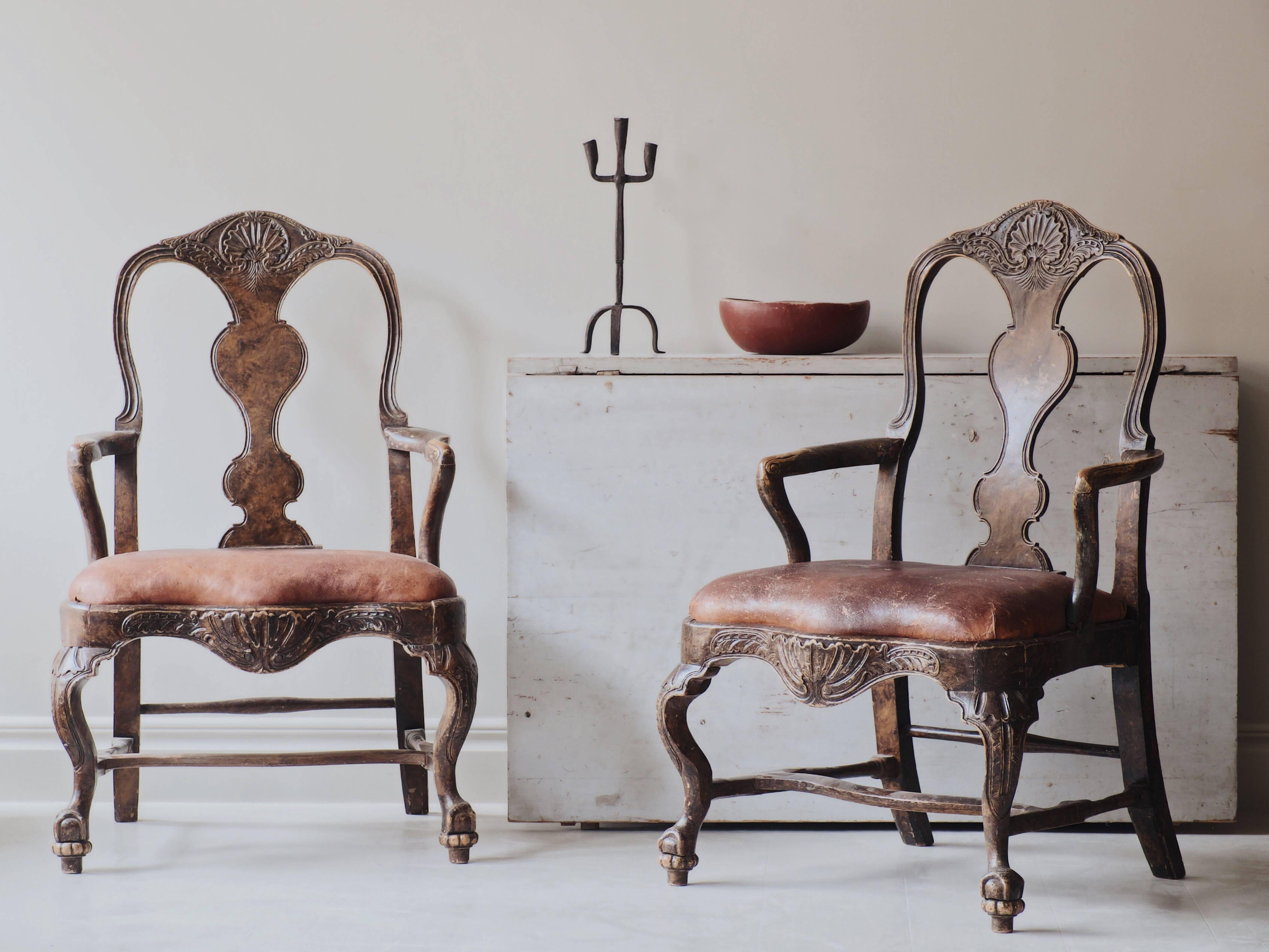 Remarkable pair of 18th century Swedish transitional Baroque or Rococo armchairs with fine carvings with a great patina to the surface, circa 1750, Sweden.