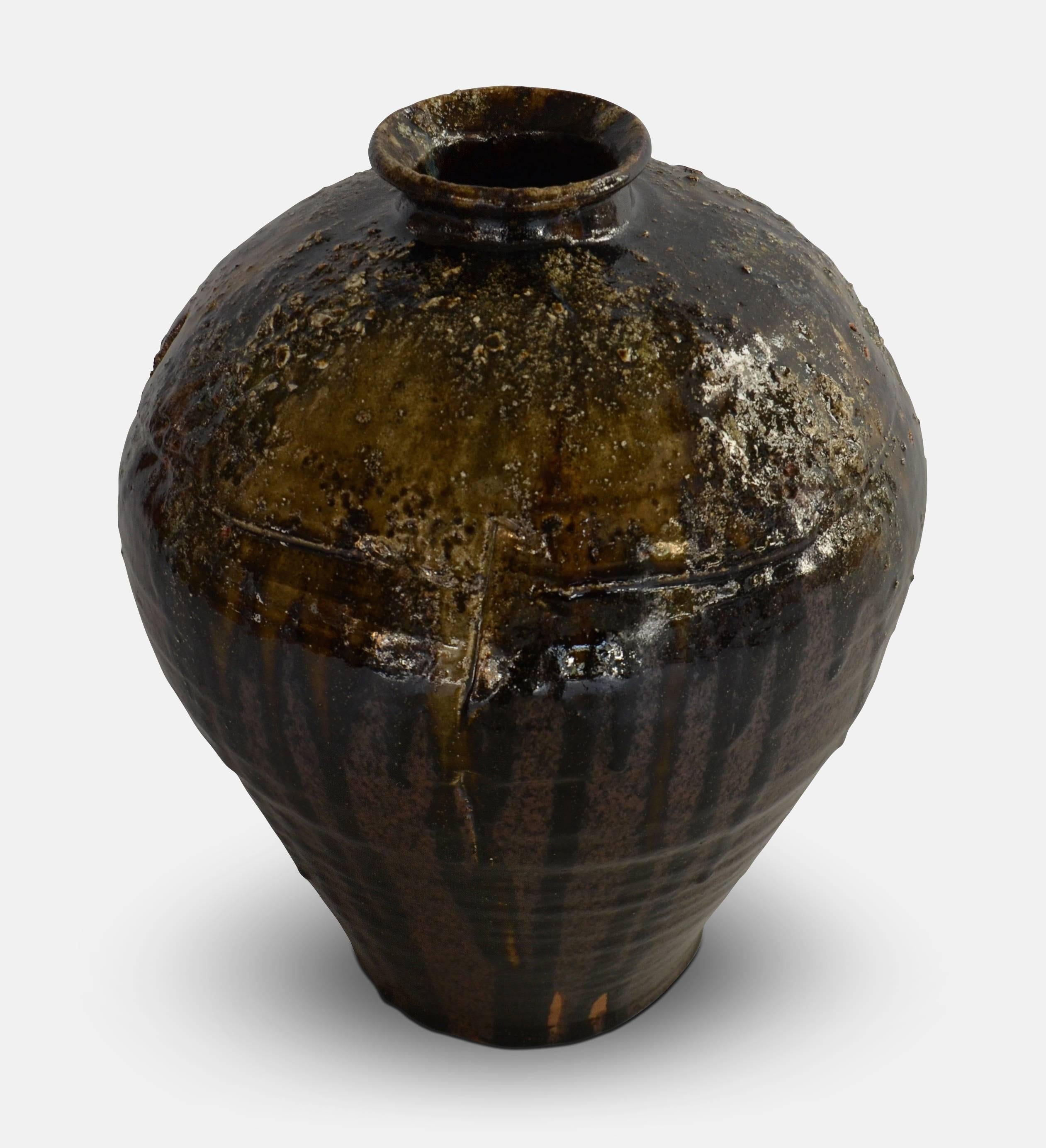 Hans Vangsø, (1950).
Floor vase with brown glaze mixed with seaweed. 
Educated at Academy of Fine Arts, Aarhus. Lives and works in Knebel, Denmark. Represented at The National Art Foundation of Denmark, The National Swedish Art Foundation,