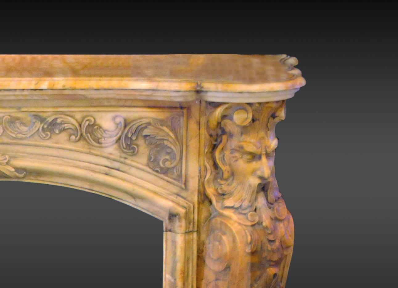 Rare sculpted Louis XV style fireplace in yellow marble
