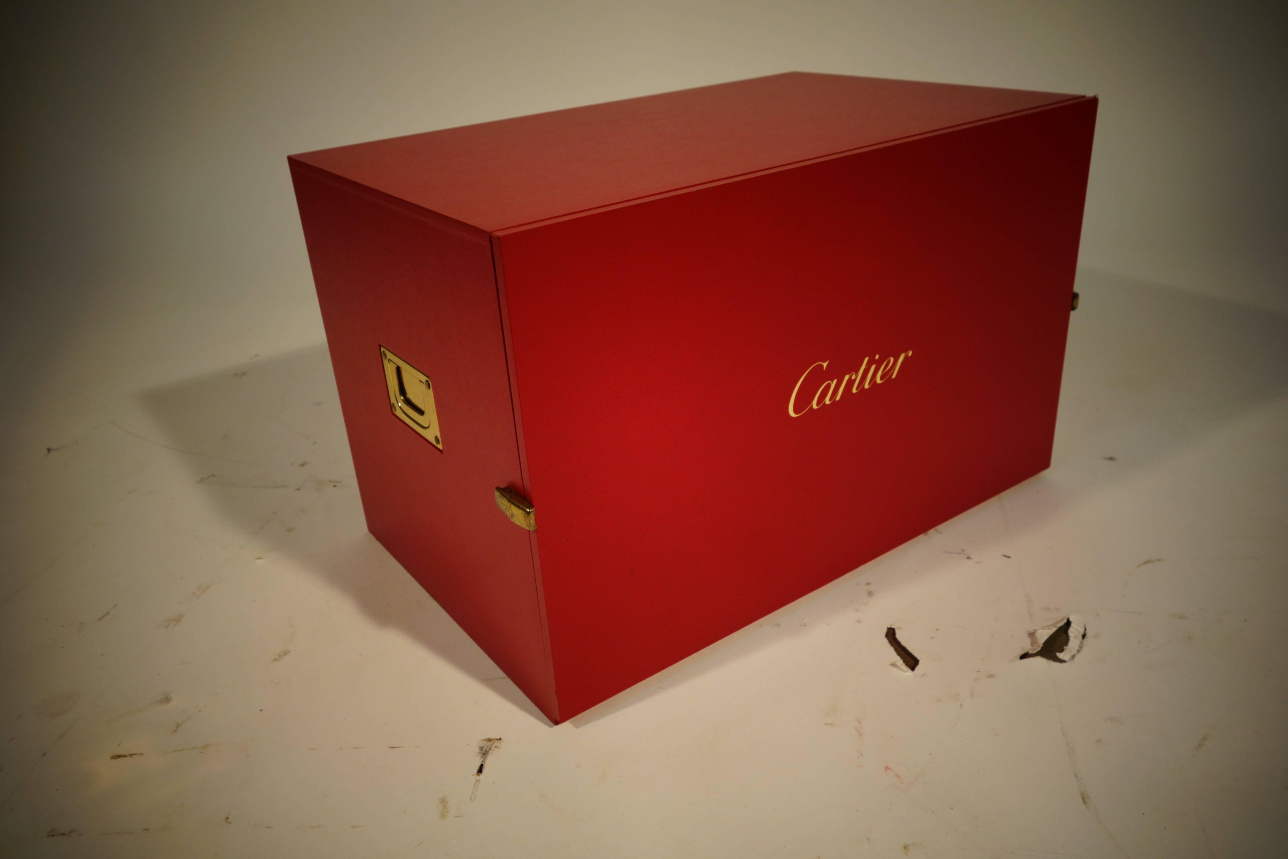 Cartier watch box for accessories.
You find this kind of boxes in Cartier Shop.
Free shipping. 

14 drawers.

Each drawer has a removable plastic separator for storing the accessories of watches and jewelry.

Size in cm 47 cm wide x 30 cm