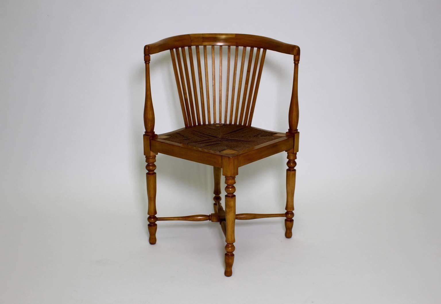 Jugendstil vintage corner chair from maple tree by Adolf Loos and executed by F.O.Schmidt.
The corner chair features solid shellac polished maple tree in honey brown color tone.
The network seat shows the original string, while the feet are
