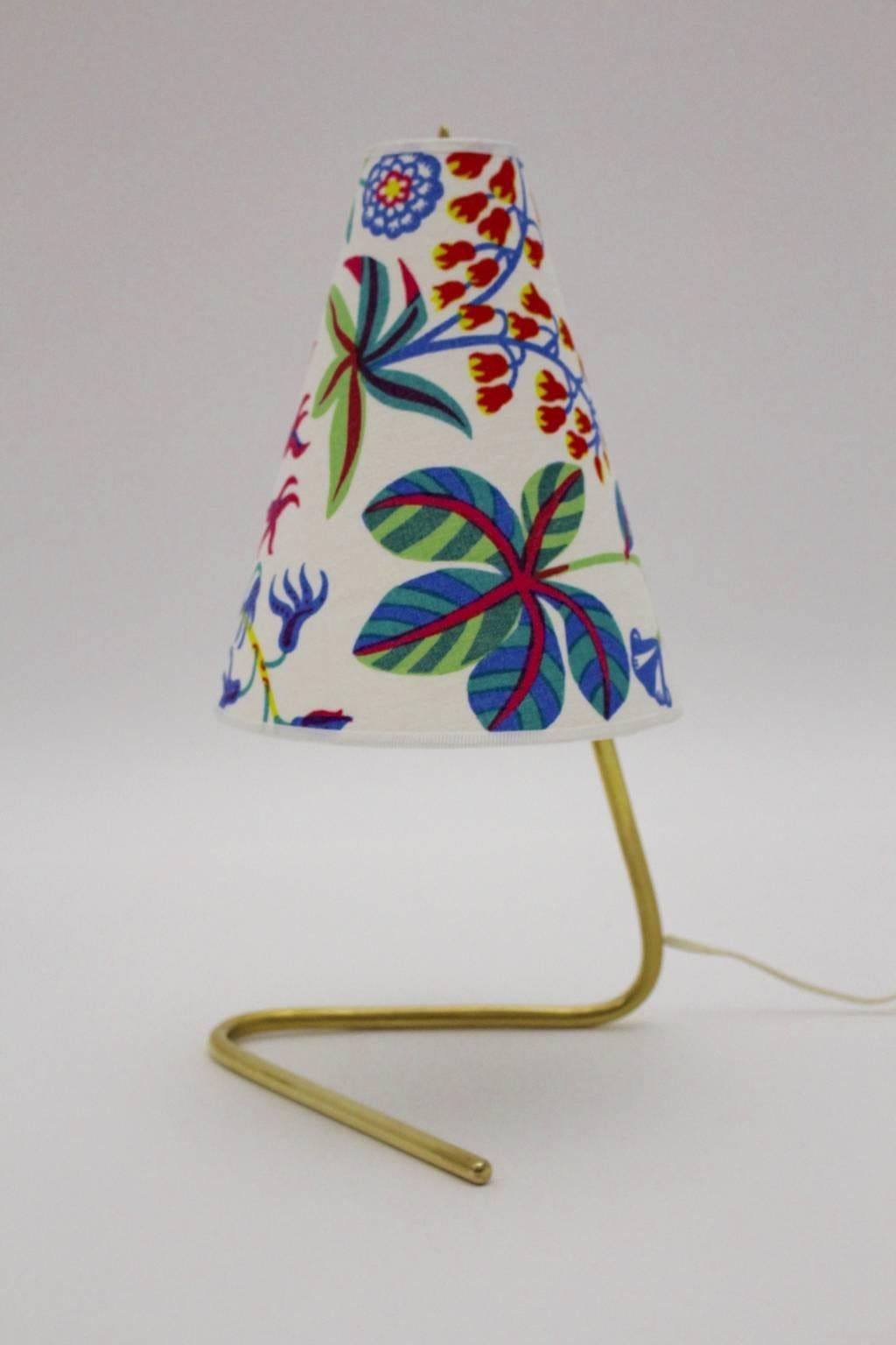 Mid century modern vintage brass table lamp by Rupert Nikoll, Vienna, Austria, 1950s, which tells great Austrian design spirit from the 1950s.
Also the renewed lamp shade is covered with high quality Josef Frank design textile fabric by Svenskt