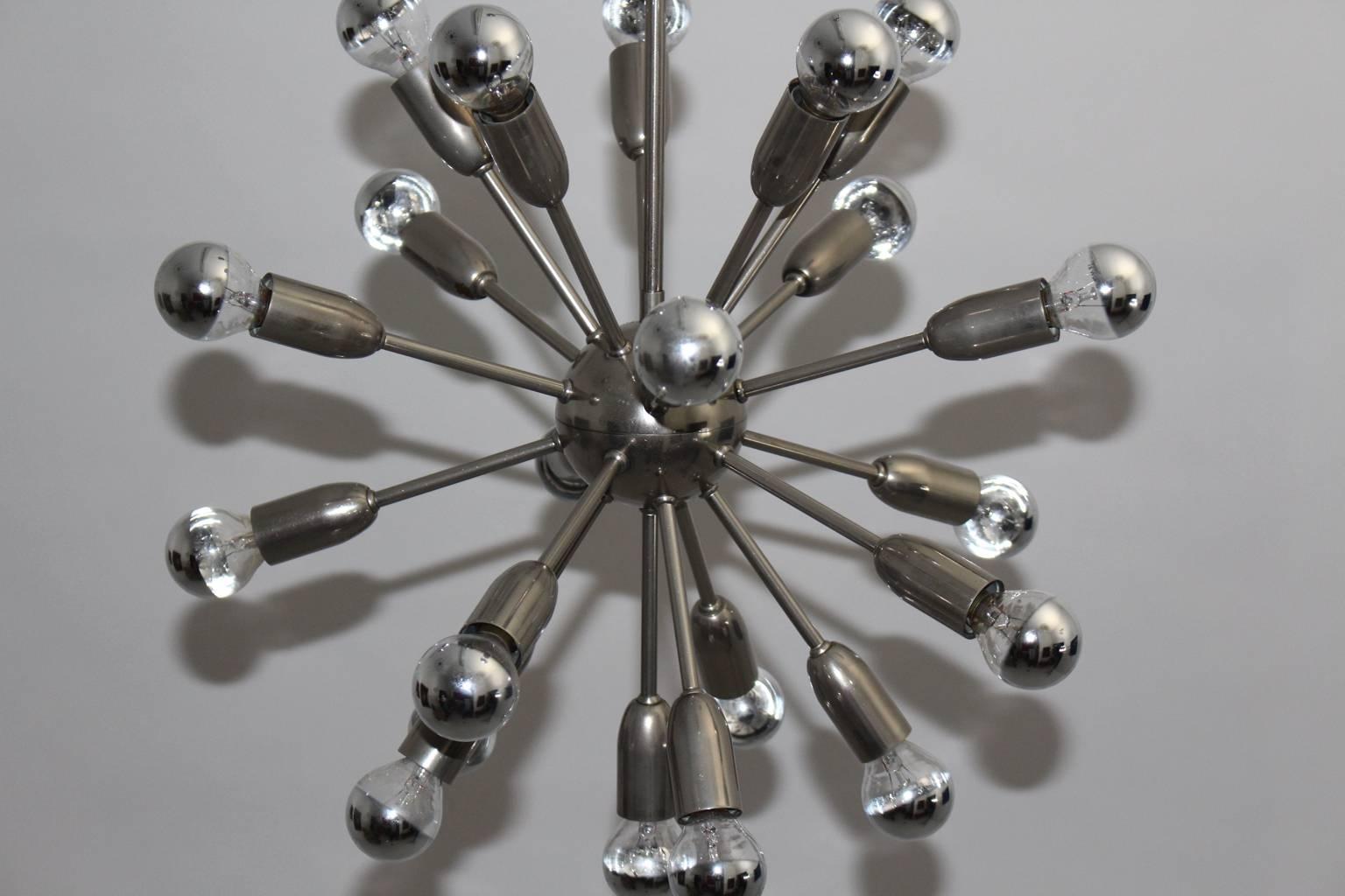 Mid Century Modern nickel-plated metal Sputnik chandelier with 21 arms, which was designed 1960s Italy.
Metal sockets with round chromed bulbs E 14.

Measurements:
Diameter 19.68 in (50cm),
height 30.31 in (77cm).
All measures are approximate.