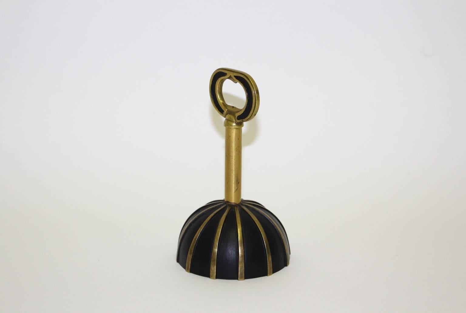 Lovely table bell, made of black patinated cast-brass, partly polished, with a wonderful sound and three possibilities to use: 
Bell - Corkscrew - Bottle Opener.
This tableware is in best vintage condition.
All measures are approximate.