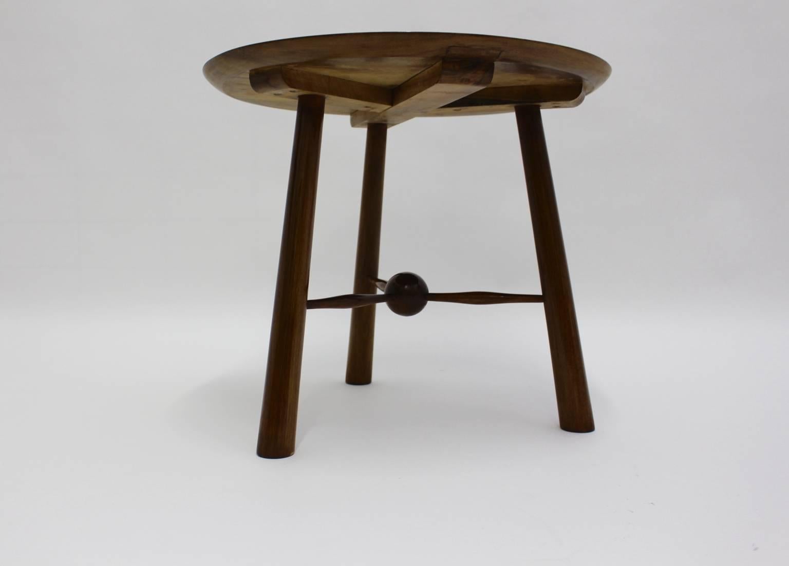 Art deco vintage tripod coffee table, which was designed by Walter Sobotka, Vienna 1930s.
A stunning and refreshed coffee table or side table from solid walnut in very good and ready to live condition.
This presented coffee table shows a round top