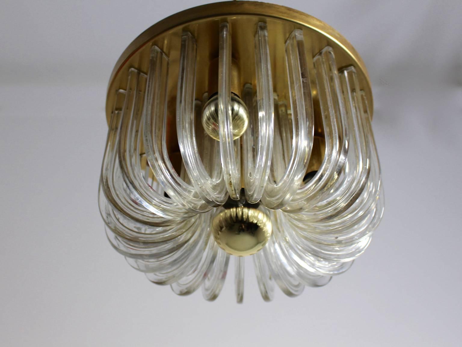 A mid century modern glass brass vintage flush mount, which was designed by Cari Zalloni 1960s and manufactured by the lighting company Bakalowits, Vienna.
Cari Zalloni ( 1937 - 2012 ) studied under Oswald Haerdtl at the masterclass of the Academy